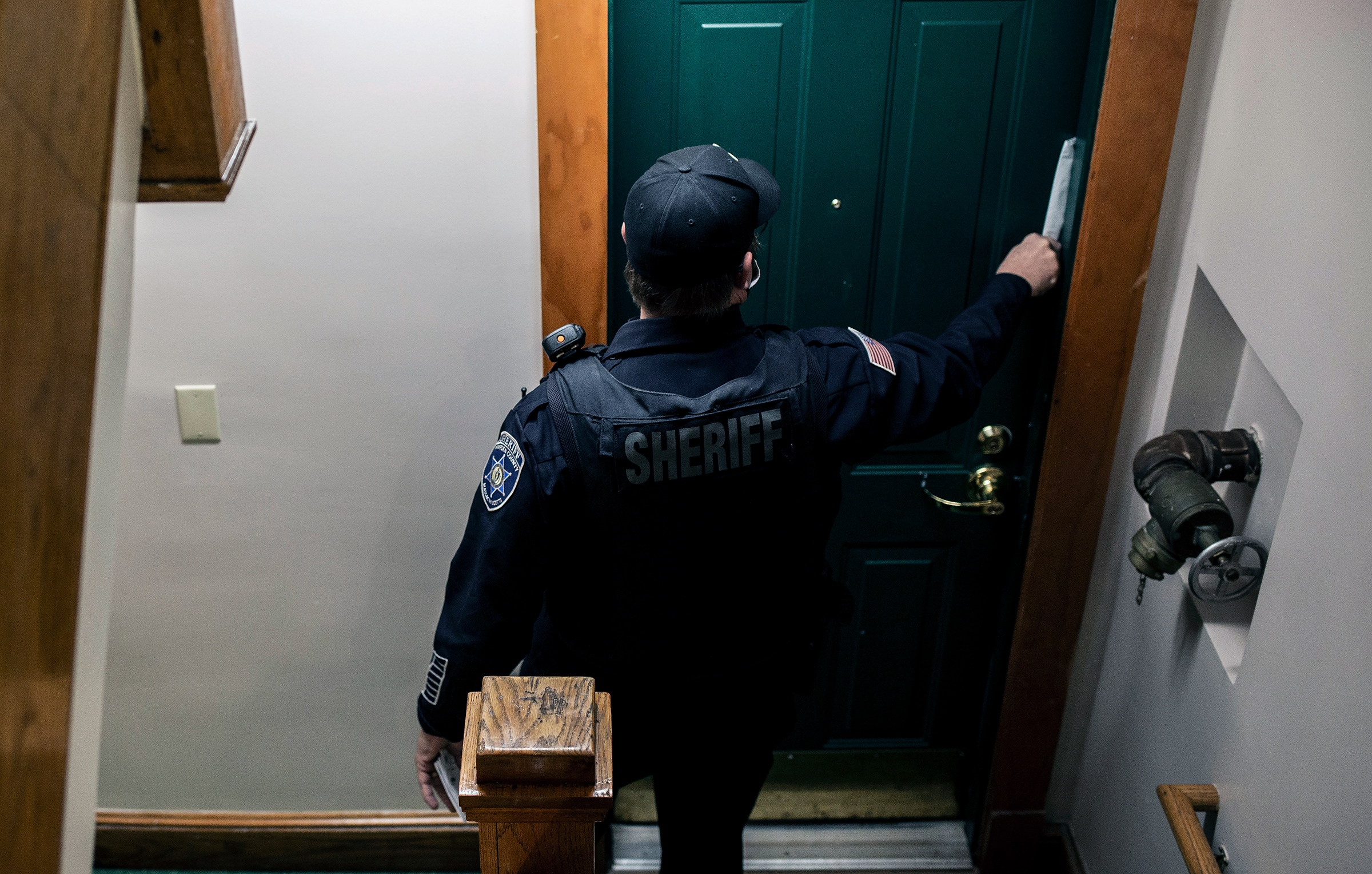 An eviction notice is placed in the doorway of an apartment in Springfield, Mass., on Dec. 16, 2020. A moratorium on evictions did little to address the bigger problem: The country is running out of affordable places for people to live. (Bryan Anselm—The New York Times/Redux)