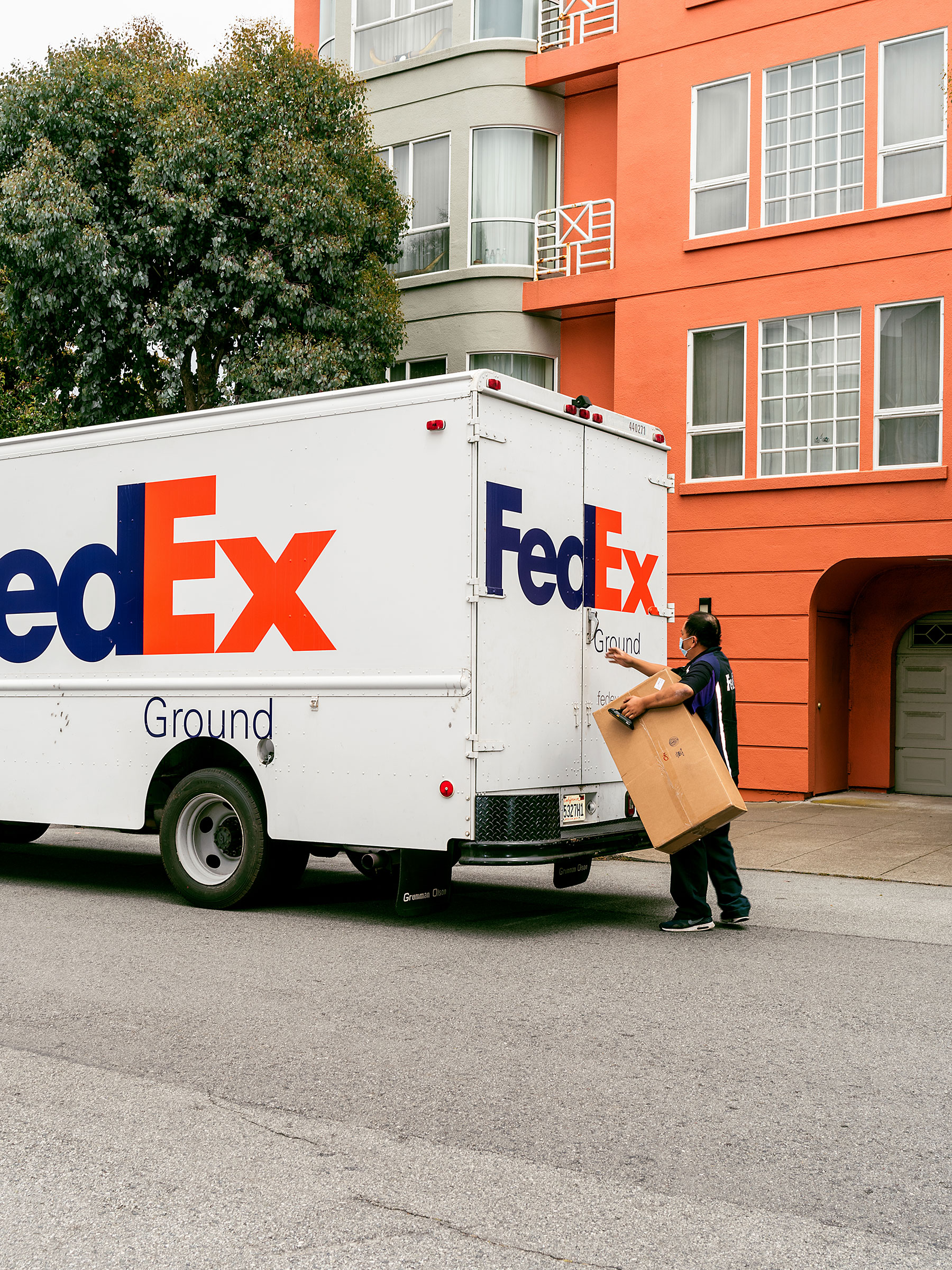 A box containing Jani the giraffe arrives via FedEx to a residence in San Francisco. (Kelsey McClellan for TIME)