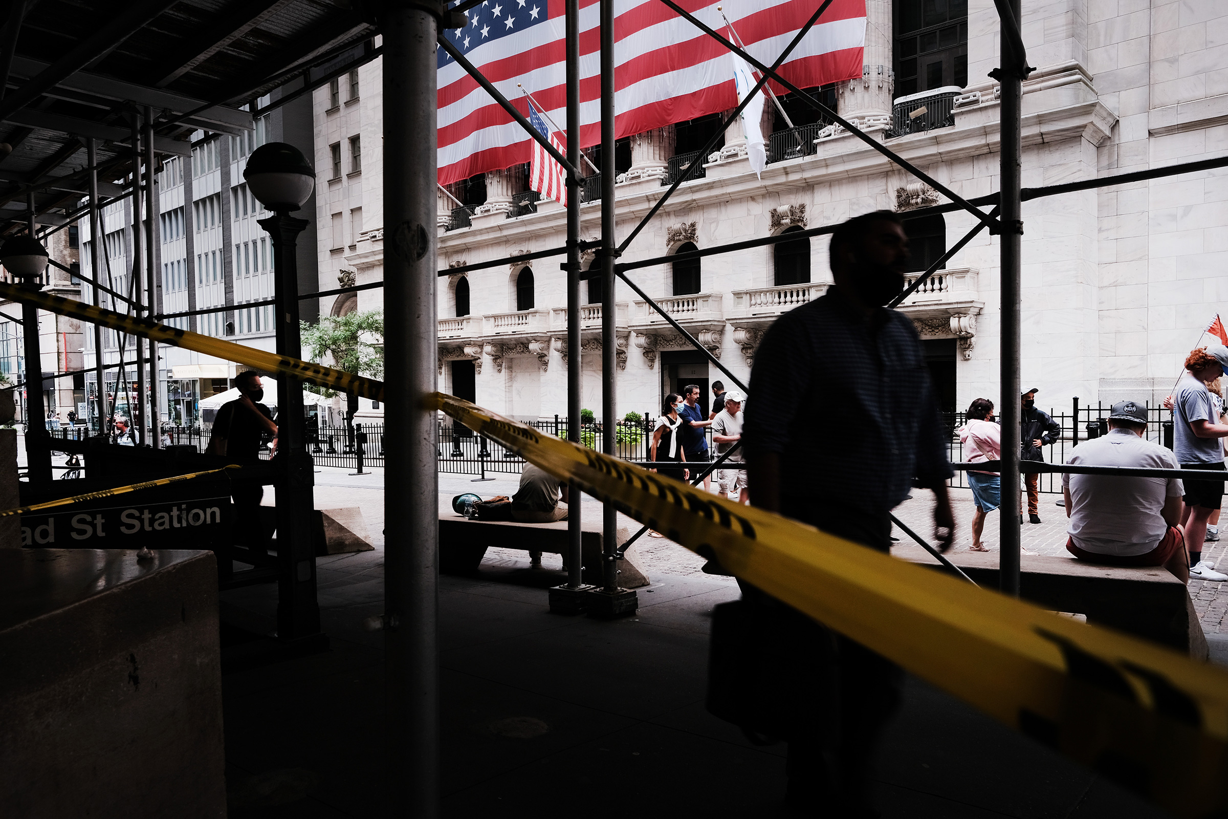 People walk by the New York Stock Exchange in New York City on Aug. 10, 2021 (Spencer Platt—Getty Images)