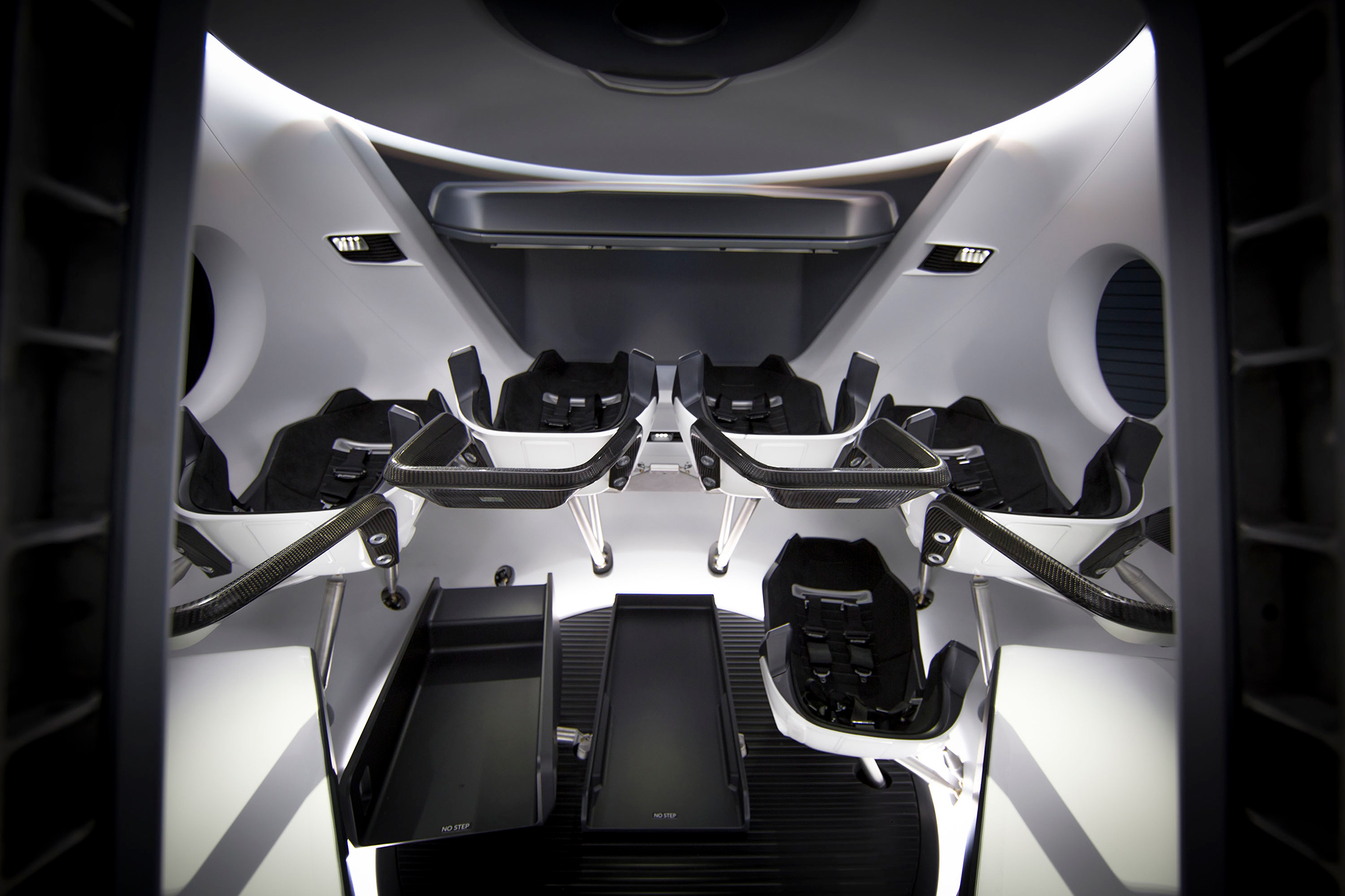 The seats in the Crew Dragon spacecraft are reconfigurable, allowing it to carry up to seven people—though four is typical for a NASA mission. Three large touchscreens replace the traditional instrument panel. (Courtesy SpaceX)