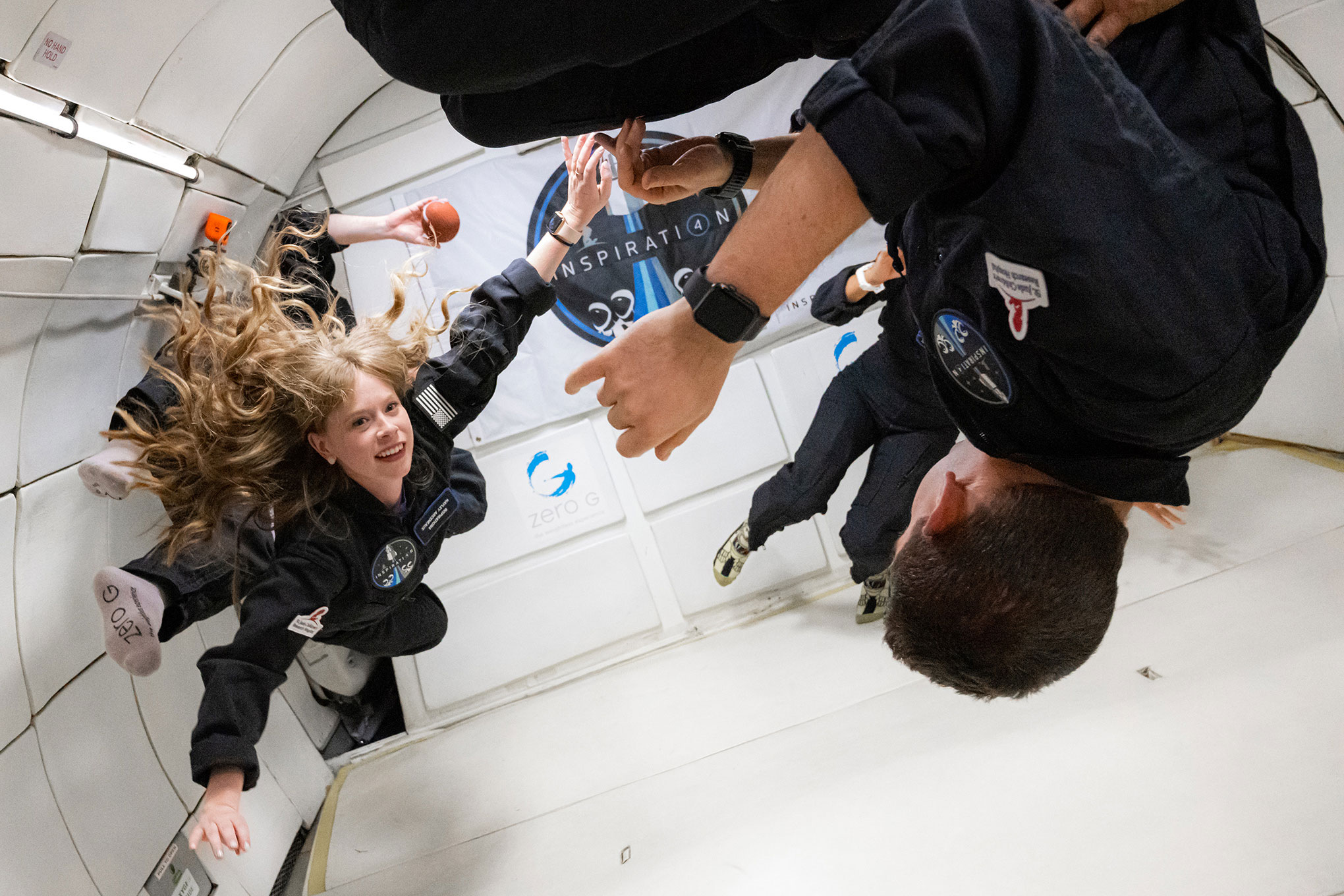 Hayley Arceneaux (left) and the rest of the Inspiration4 crew on a ZERO-G flight in Las Vegas on July 11, 2021. The plane flies in parabolic arcs to simulate zero gravity.