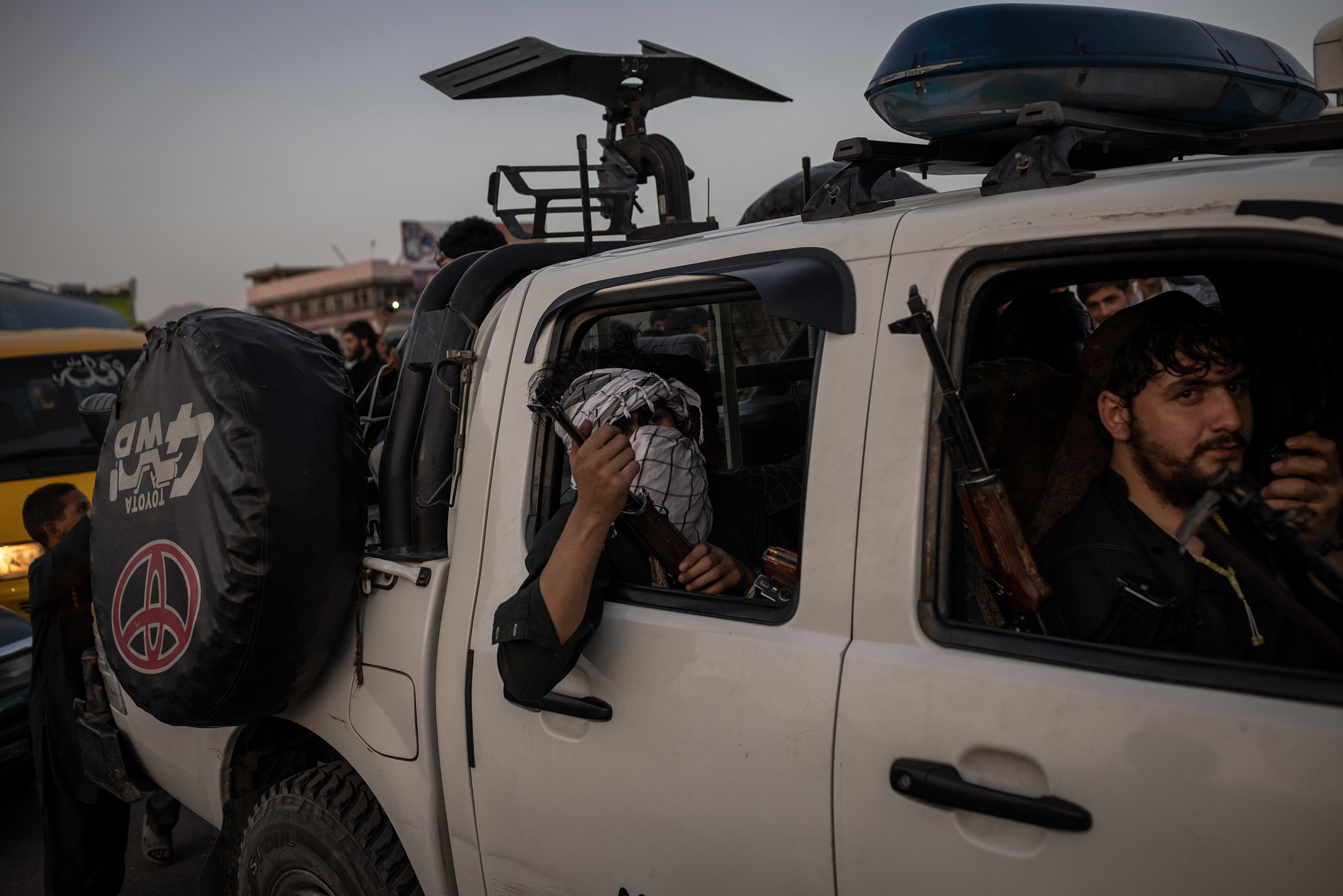 Taliban fighters drive into Kabul on Aug. 15, 2021.