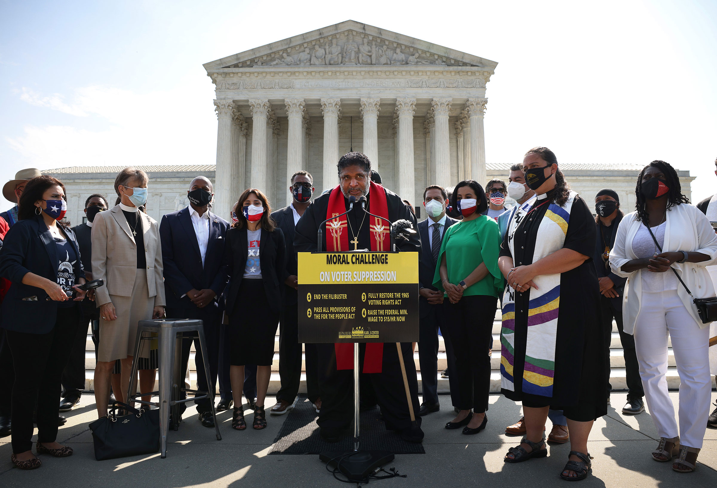 Rev. William Barber, Co-Chair of the Poor People’s Campaign, speaks alongside Texas State Representatives and fellow religious leaders, as they prepare to deliver a petition to Senate Majority Leader Charles Schumer calling for an end to the filibuster, the passage of the For The People Act and restoring the Voting Rights Act, at the U.S. Supreme Court in Washington, on Aug. 12, 2021. (Kevin Dietsch—Getty Images)