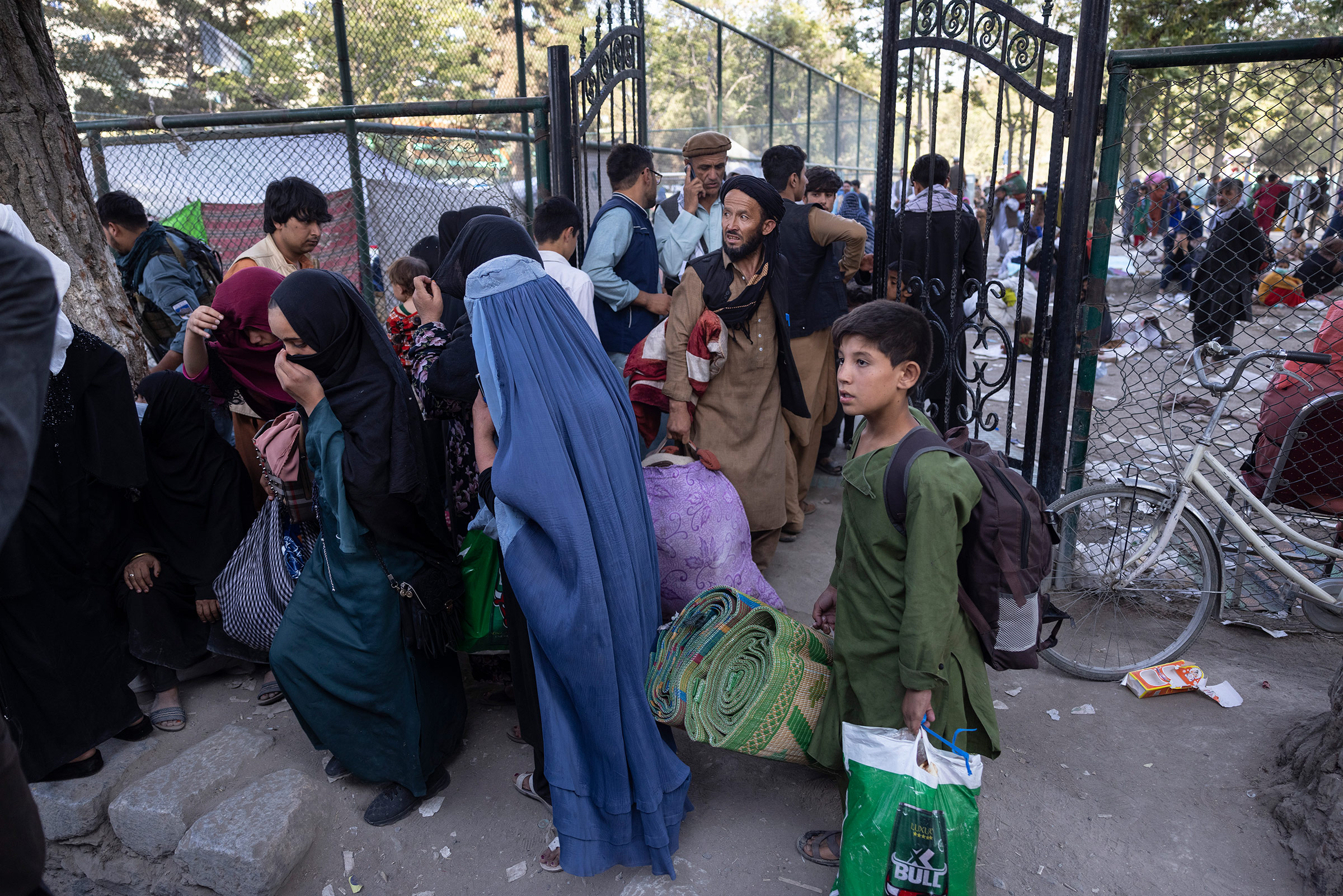Displaced Afghans from the northern provinces are evacuated from a makeshift IDP camp to various mosques and schools in Kabul, Afghanistan on Aug. 12, 2021. (Paula Bronstein—Getty Images)