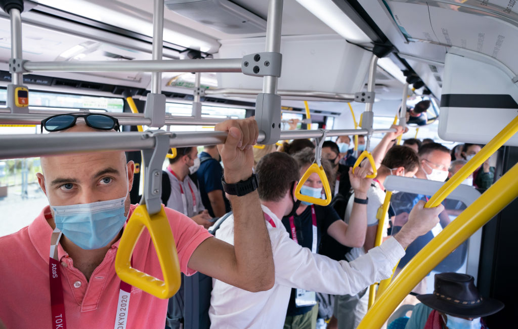 Members of the media on a packed media bus in Tokyo ahead of the Tokyo 2020 Olympic Games in Japan. Picture date: Friday July 23, 2021. (Danny Lawson—PA Images via Getty Images)