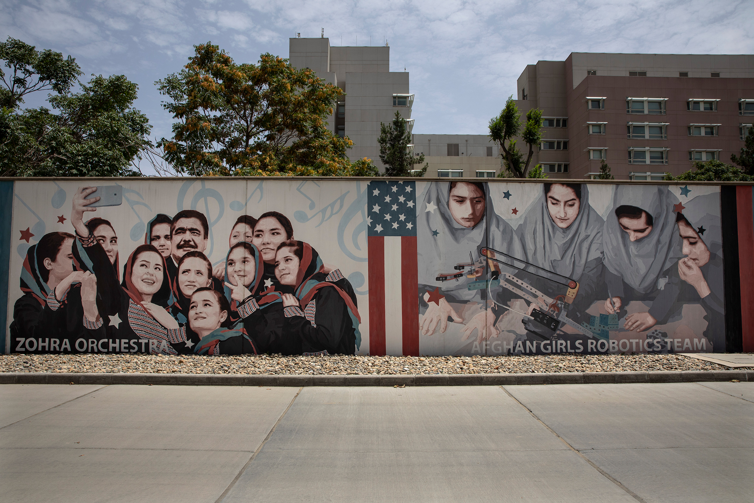 Murals are seen along the walls at the U.S. embassy in Kabul on July 30. In August, as the Taliban approached, staffers at the embassy scrambled to leave. (Paula Bronstein—Getty Images)