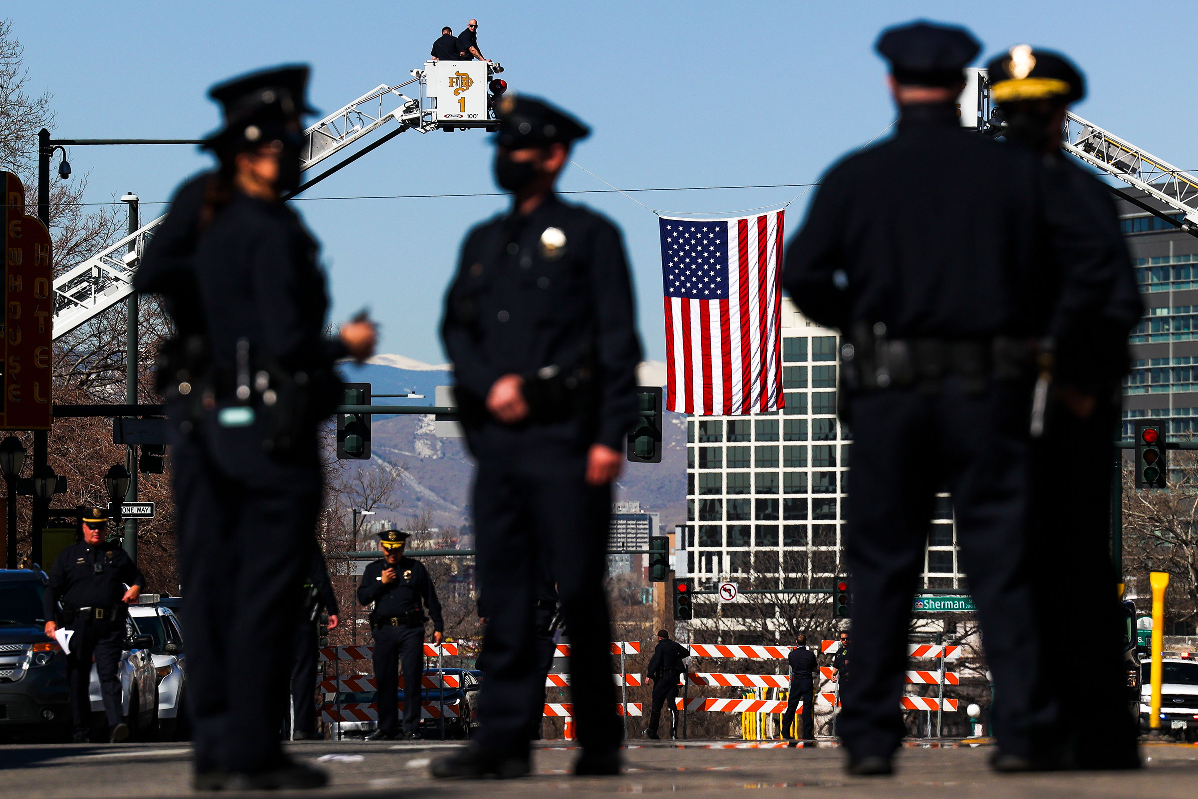 An American flag flies near the Cathedral Basilica of the Immaculate Conception during a funeral mass for slain Boulder Police officer Eric Talley on March 29, 2021 in Denver, Colorado. (Michael Ciaglo—Getty Images)