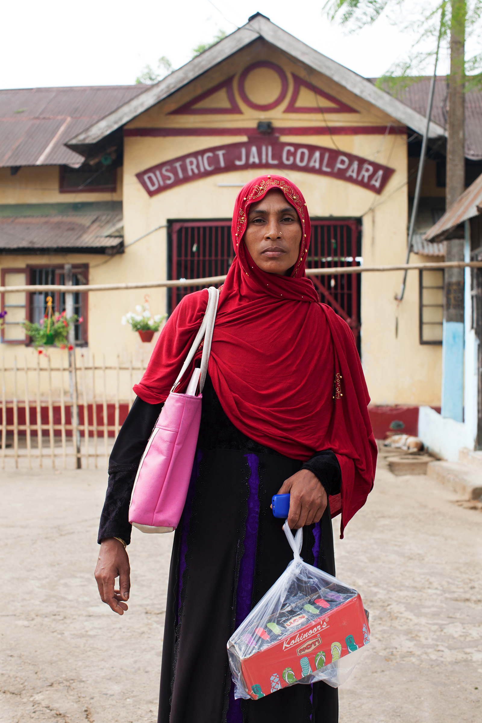 Samiran Nesa outside Goalpara district jail, where she is visiting her husband, Sohidul Islam, and carrying shoes to give him. He has been detained since December 2019, after a foreigners tribunal declared him an illegal immigrant.