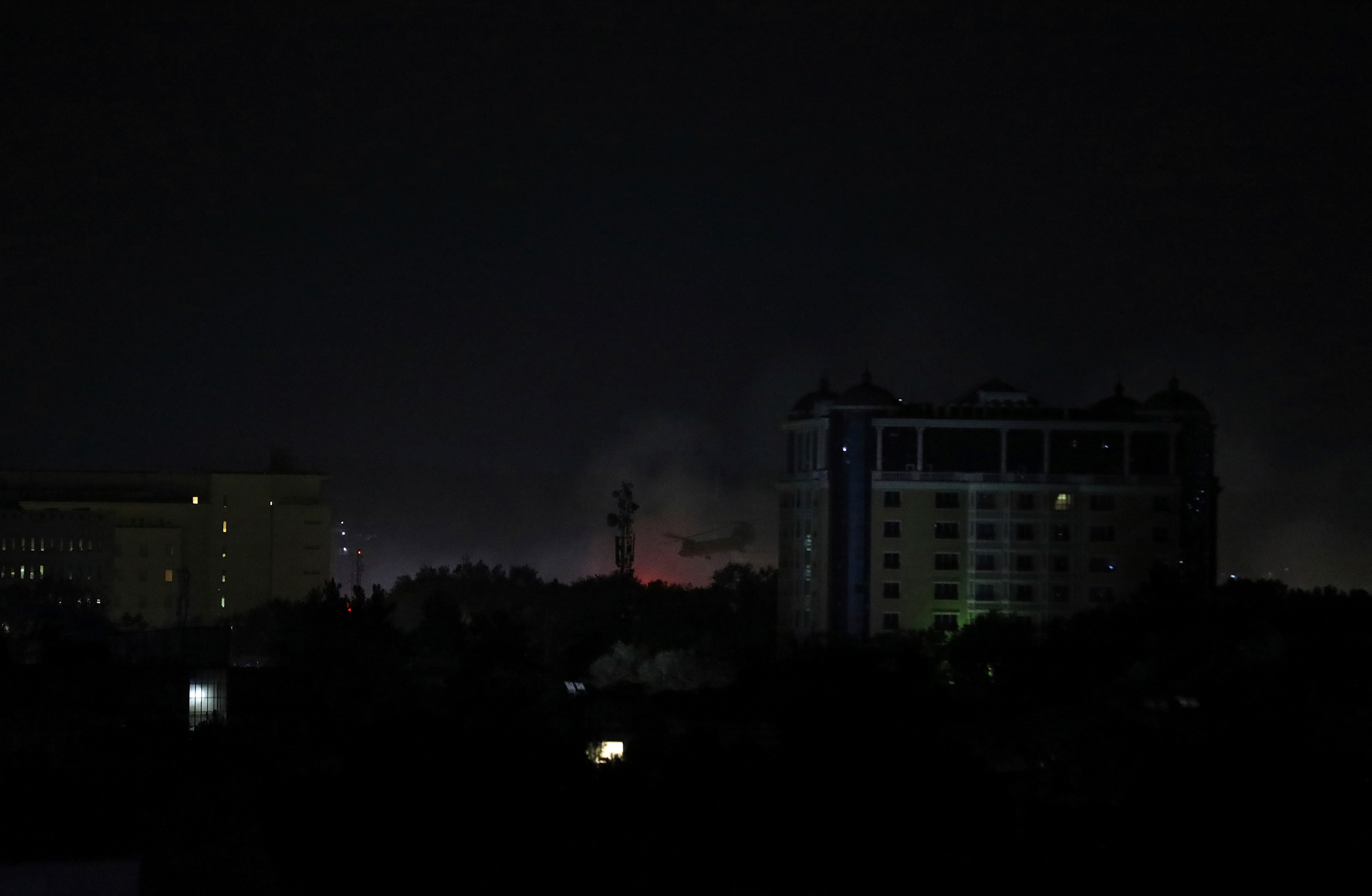 Smoke rises next to the U.S. Embassy in Kabul late on Aug. 15. (Rahmat Gul—AP)