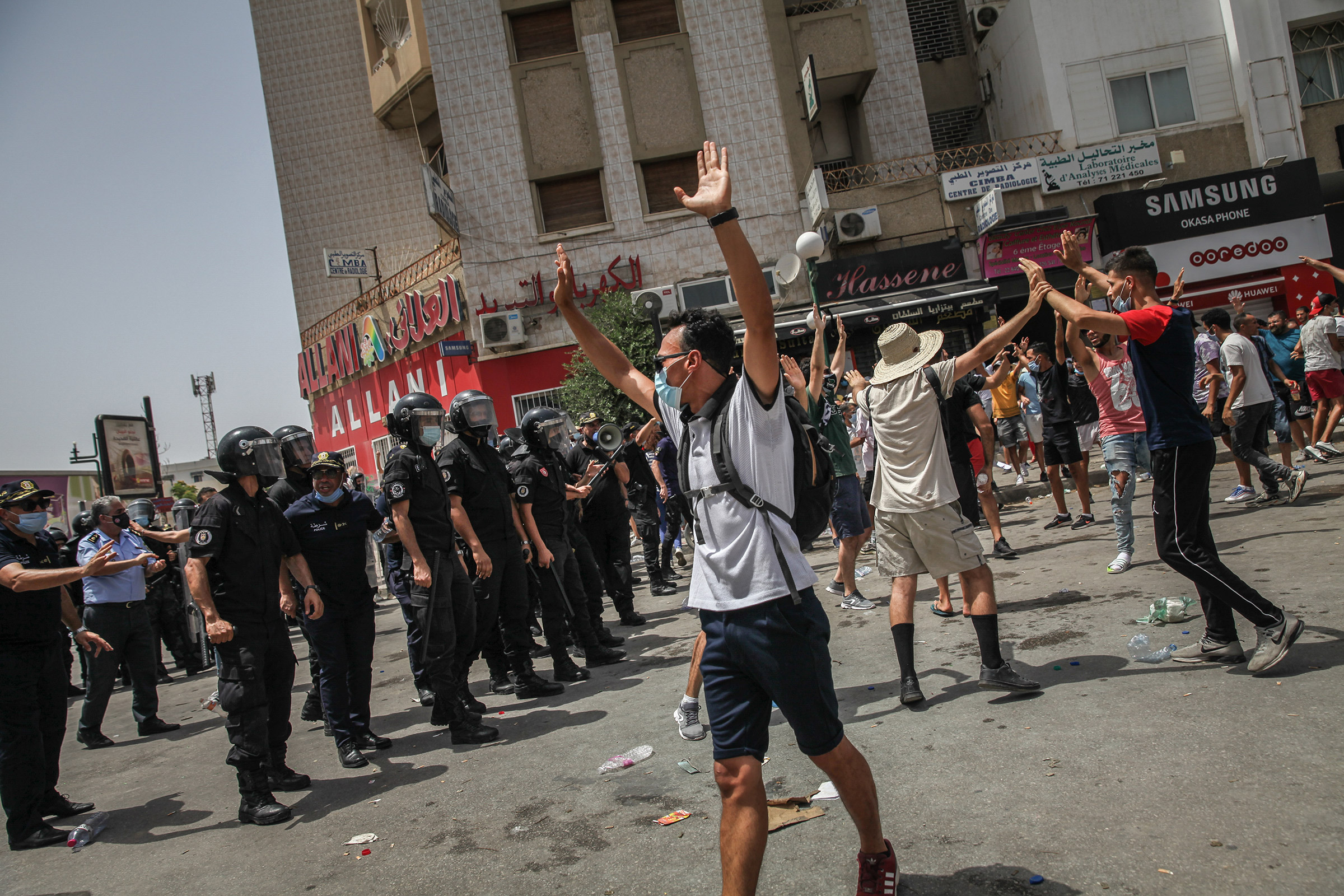 Protesters and riot police clash during a demonstration held near Parliament in Tunis, Tunisia, on July 25, 2021. (Chedly Ben Ibrahim—NurPhoto/Getty Images)
