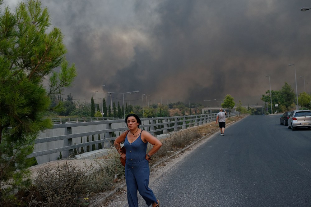 Forest fire rages in Varybobi, north of Athens, Greece on Aug. 3. Residential areas in Athens northern suburbs were evacuated as wildfires reached the outskirts of the city.