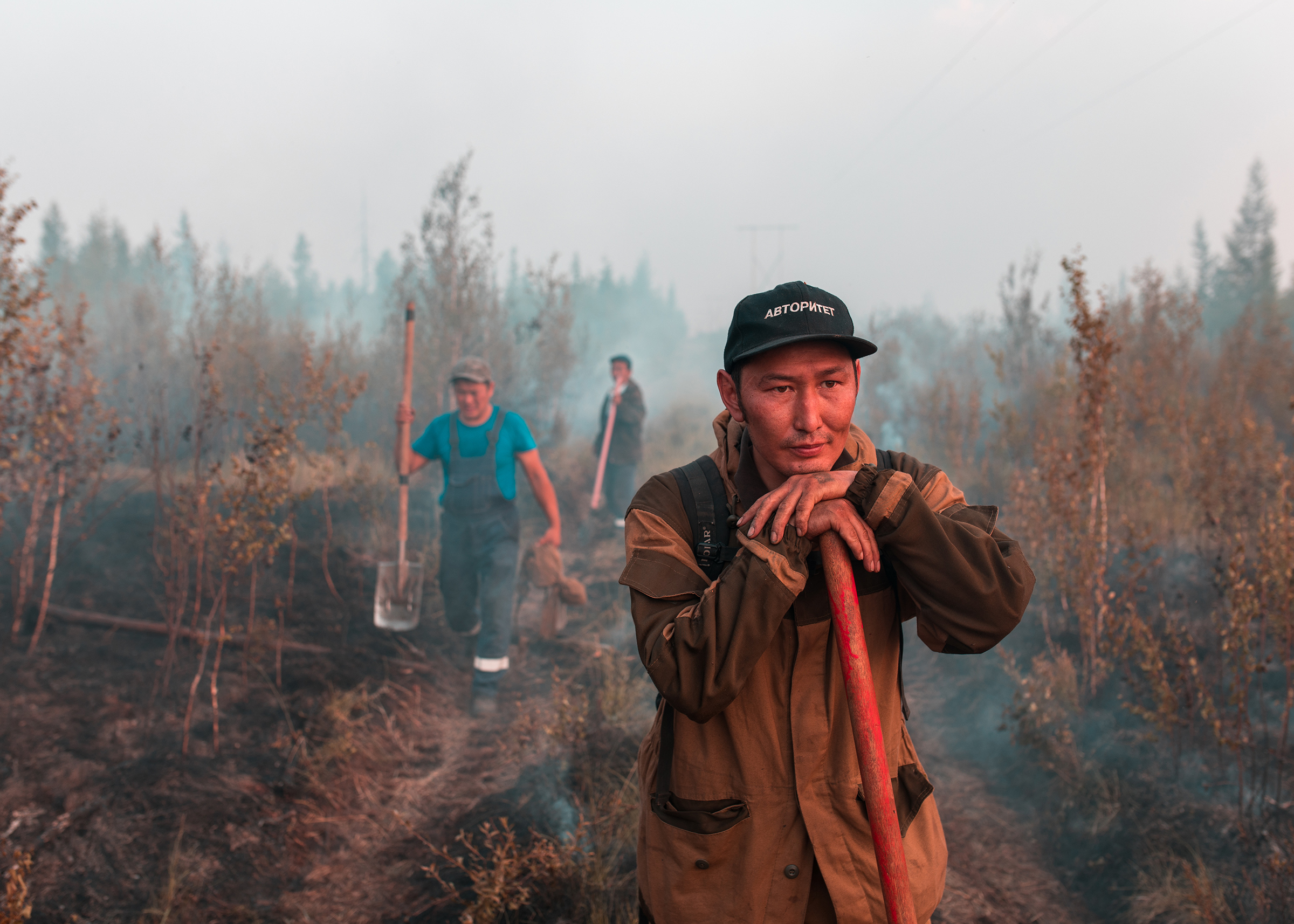 Alexander Yakovlev, 40, a volunteer from the village of Kyuerelyakh, together with his 18-year-old son Markel, has been working to extinguish wildfires near his home since early in the summer. (Alexey Vasilyev)