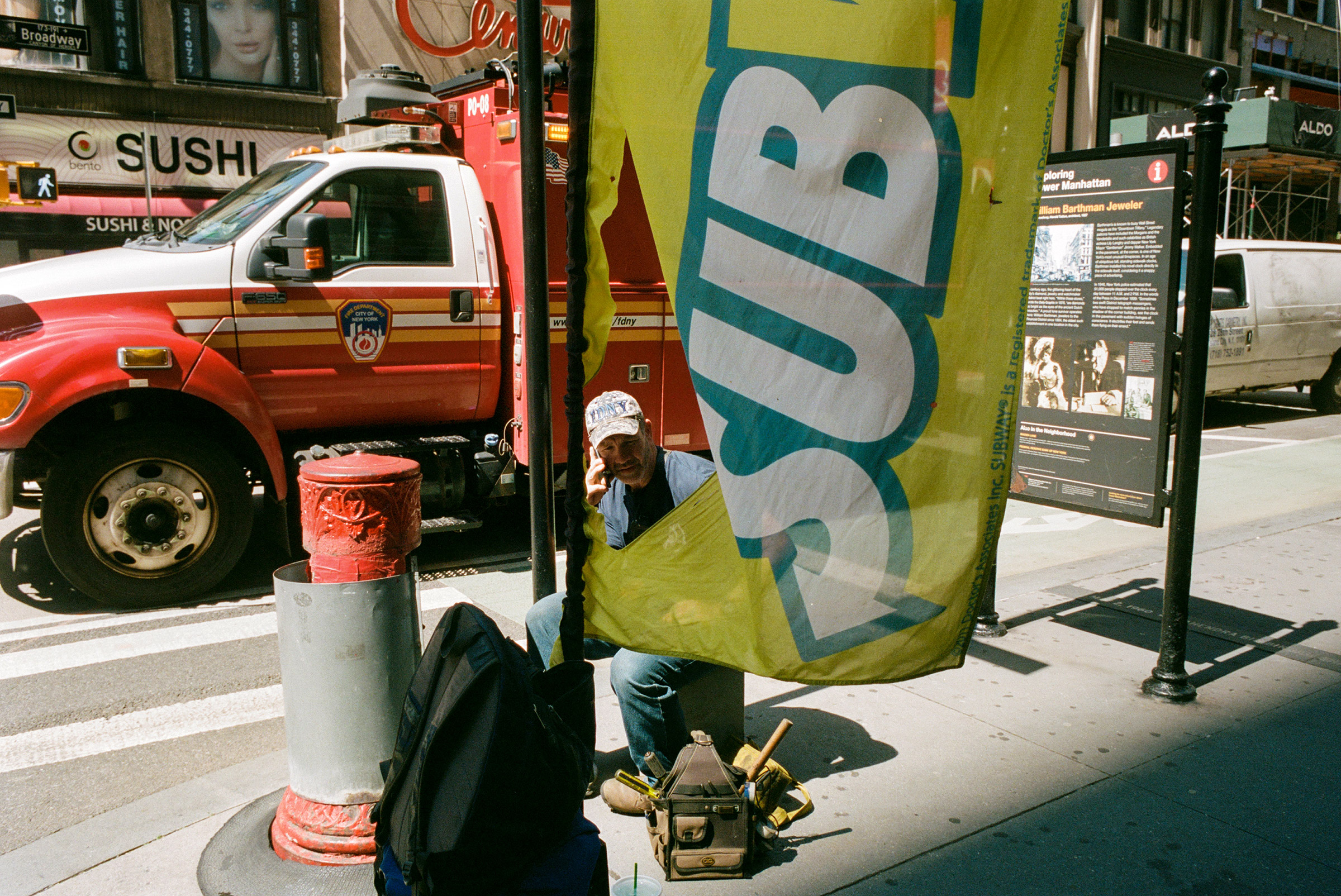 An FDNY repairman takes a break on lower Broadway, Aug. 25, 2021. (Daniel Arnold for TIME)