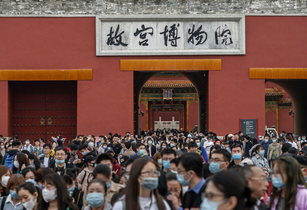 Chinese tourists crowd as they leave the exit of the Forbidden City on October 6, 2020 in Beijing, China. (Kevin Frayer/Getty Images)