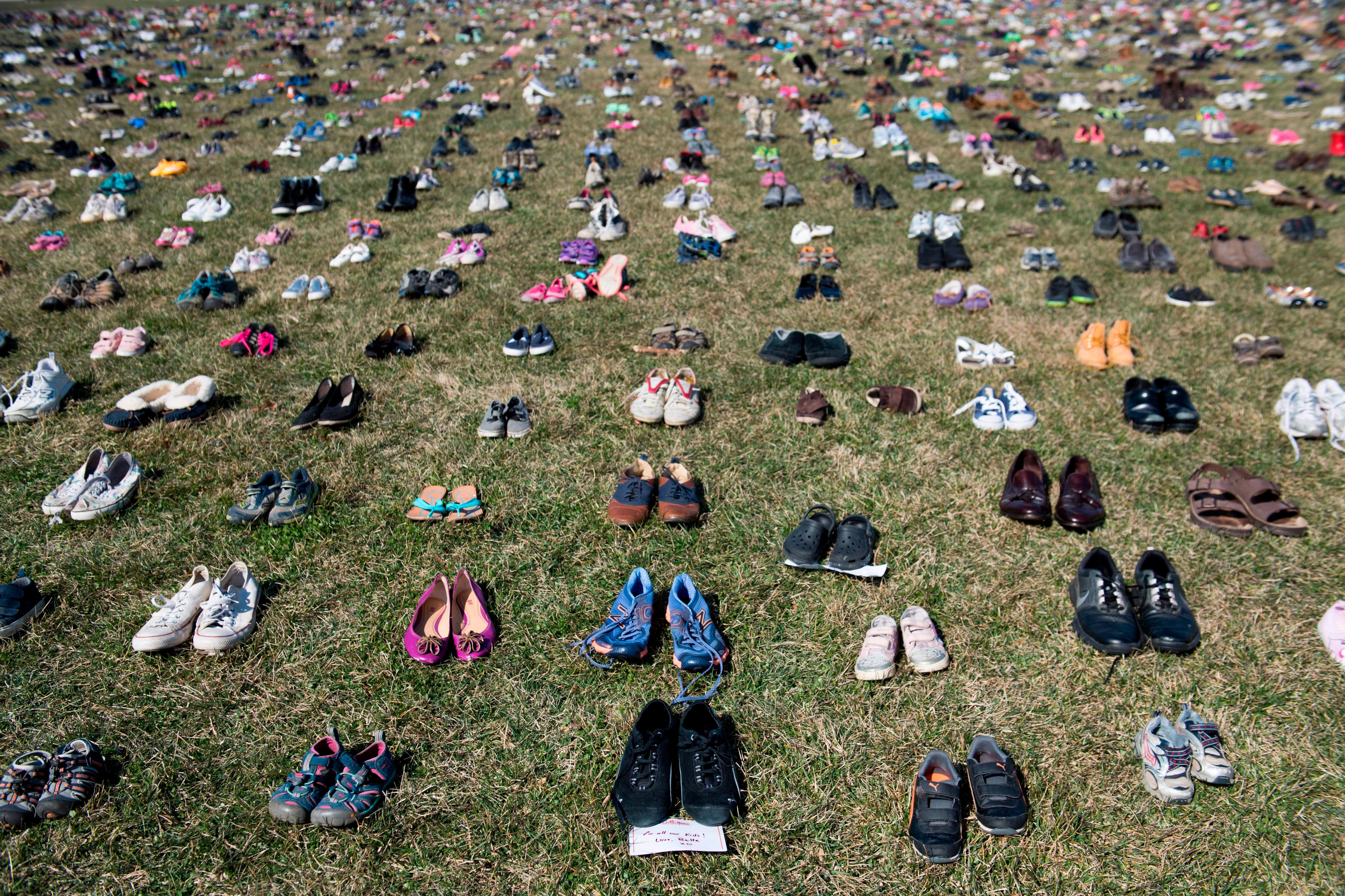 7,000 pairs of shoes are displayed on the grass outside the U.S. Capitol on March 13, 2018, to memorialize the children killed in gun violence since the Sandy Hook school shooting. (Saul Loeb—AFP/Getty Images)