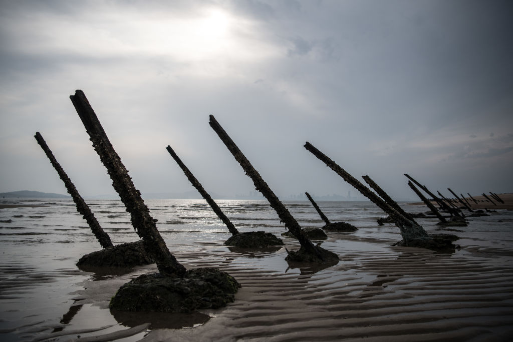 Aged anti-landing barricades are positioned on a beach facing China on the Taiwanese island of Kinmen which, at points lies only a few miles from China, on April 19, 2018 in Kinmen, Taiwan. (Carl Court/Getty Images)