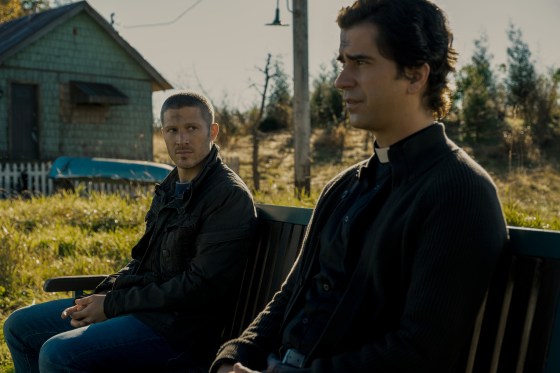 MIDNIGHT MASS (L to R) ZACH GILFORD as RILEY FLYNN and HAMISH LINKLATER as FATHER PAUL in episode 102 of MIDNIGHT MASS Cr. EIKE SCHROTER/NETFLIX Â© 2021