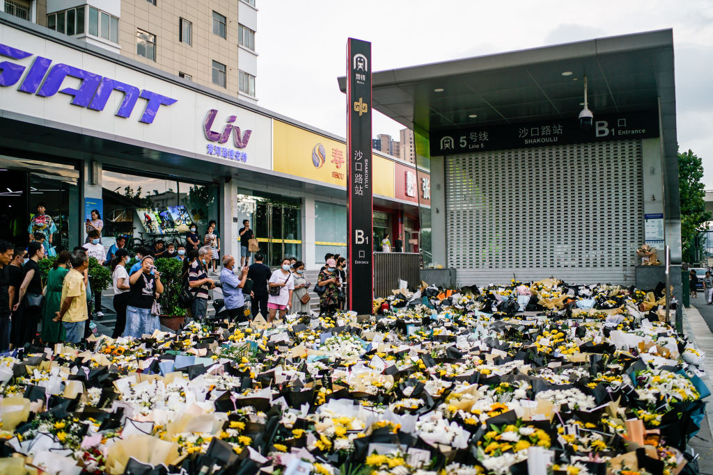 Flowers at the entrance of Shakoulu subway station to mourn those who died after getting trapped in a flooded subway on July 28, 2021 in Zhengzhou, Henan Province of China. (Cai Xingzhuo–JIEMIAN NEWS/VCG/ Getty Images)