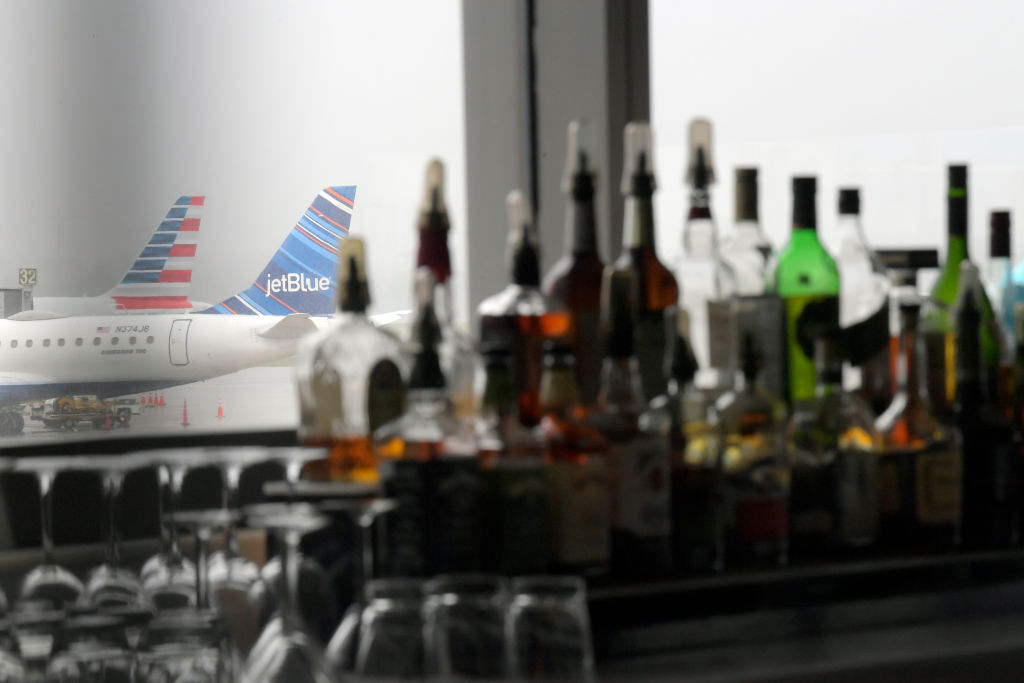 The bar area of a restaurant overlooks some of the planes parked at the gates at Reagan National Airport in Arlington, Virginia on April 30, 2020. (John McDonnell—The Washington Post/Getty Images)