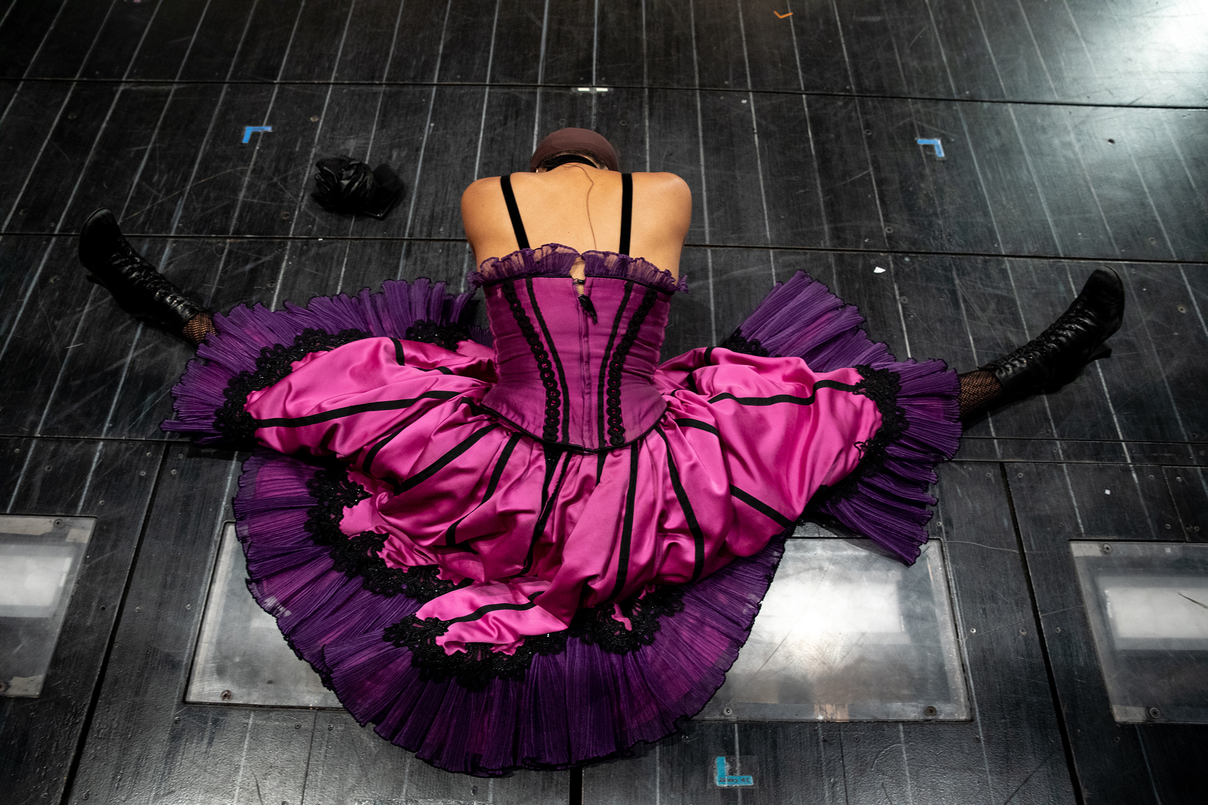 Ensemble member Bahiyah Hibah stretches on stage during rehearsal for <i>Moulin Rouge!</i> on Sept. 21, 2021 in New York, N.Y.