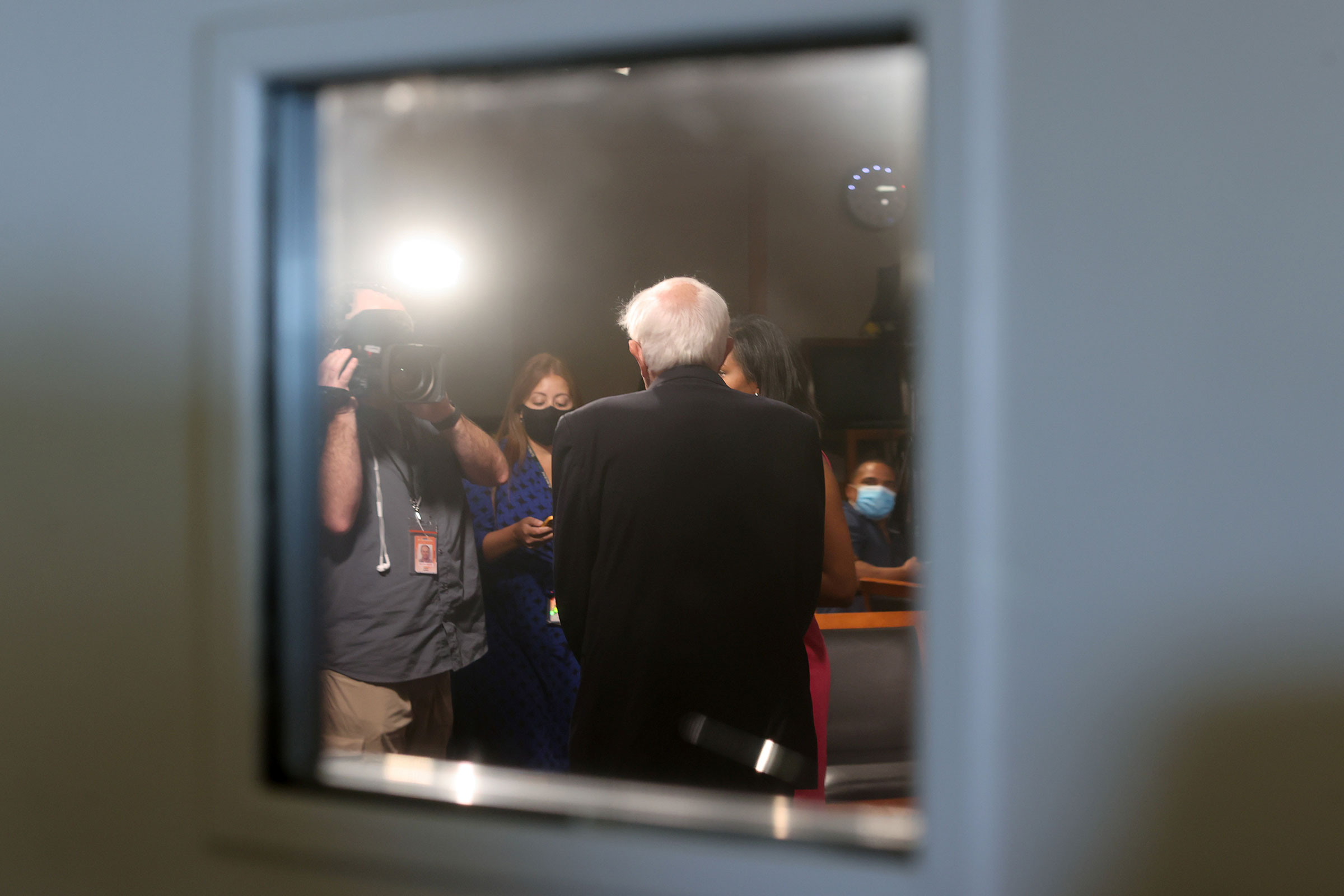 Sanders takes time for a television interview between votes on the Senate floor prior to passage of a $1 trillion bipartisan infrastructure bill on Aug. 10. (Jonathan Ernst—Reuters)