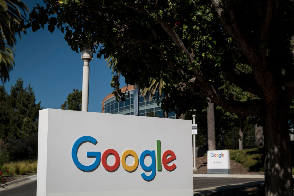 Signage is displayed in front of a building on the Google campus in Mountain View, California, U.S., on Wednesday, Oct. 21, 2020. The U.S. Justice Department sued Alphabet Inc.'s Google in the most significant antitrust case against an American company in two decades, kicking off what promises to be a volley of legal actions against the search giant for allegedly abusing its market power. (David Paul Morris-Bloomberg)