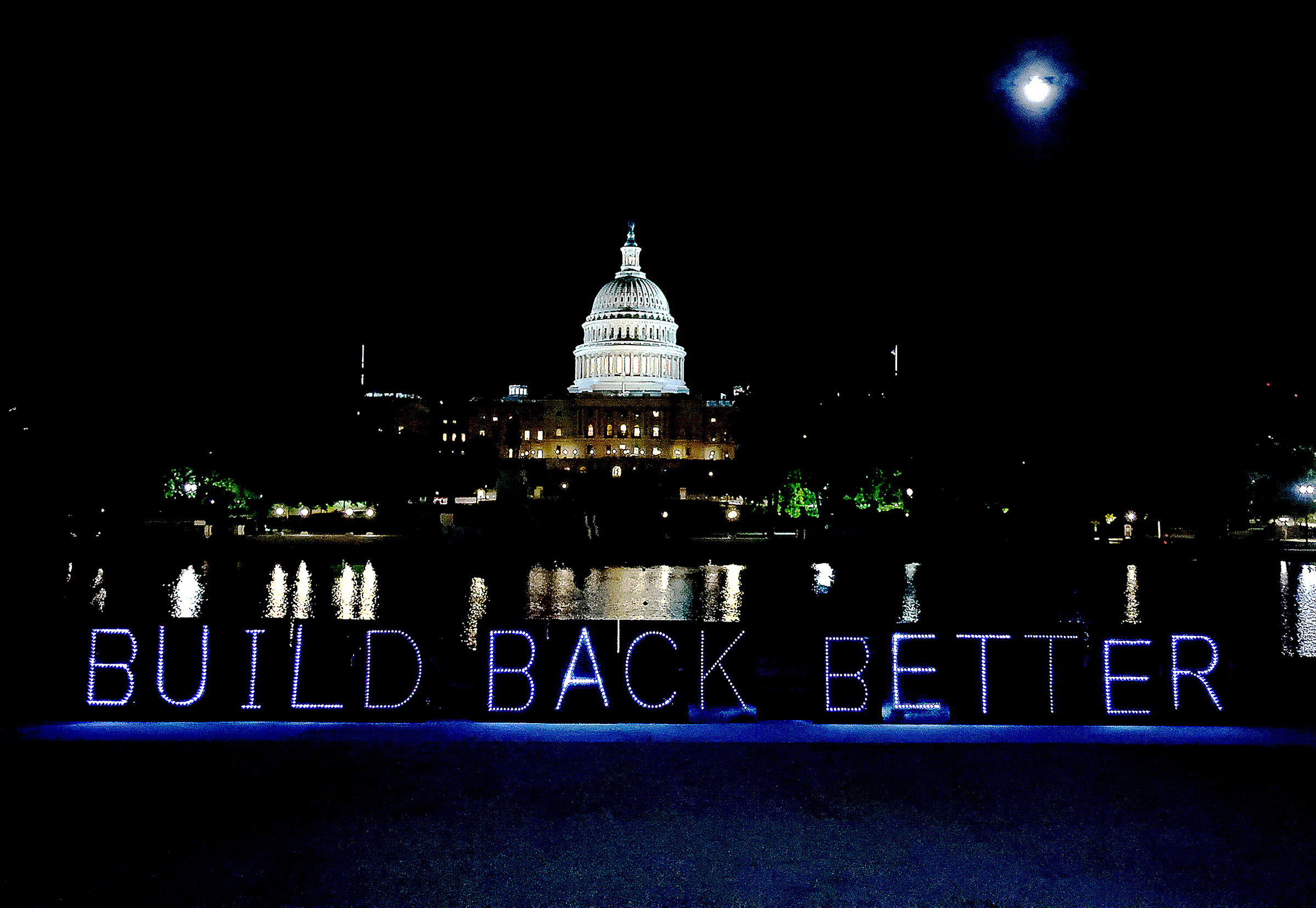 #CareCantWait light projection advocating for the passage of "Build Back Better" budget reconciliation outside of the Capitol in Washington, on Sept. 21, 2021 (Paul Morigi—Unbendable Media/Getty Images)