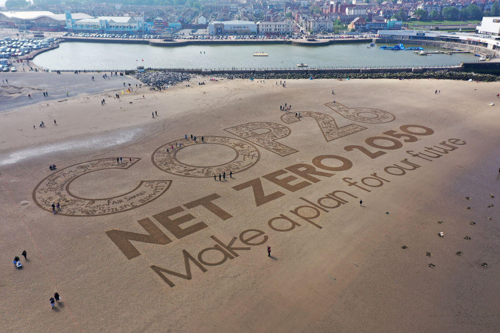 A giant sand artwork adorns New Brighton Beach, Merseyside, U.K., to highlight global warming and the forthcoming COP26 global climate conference. (Christopher Furlong—Getty Images)