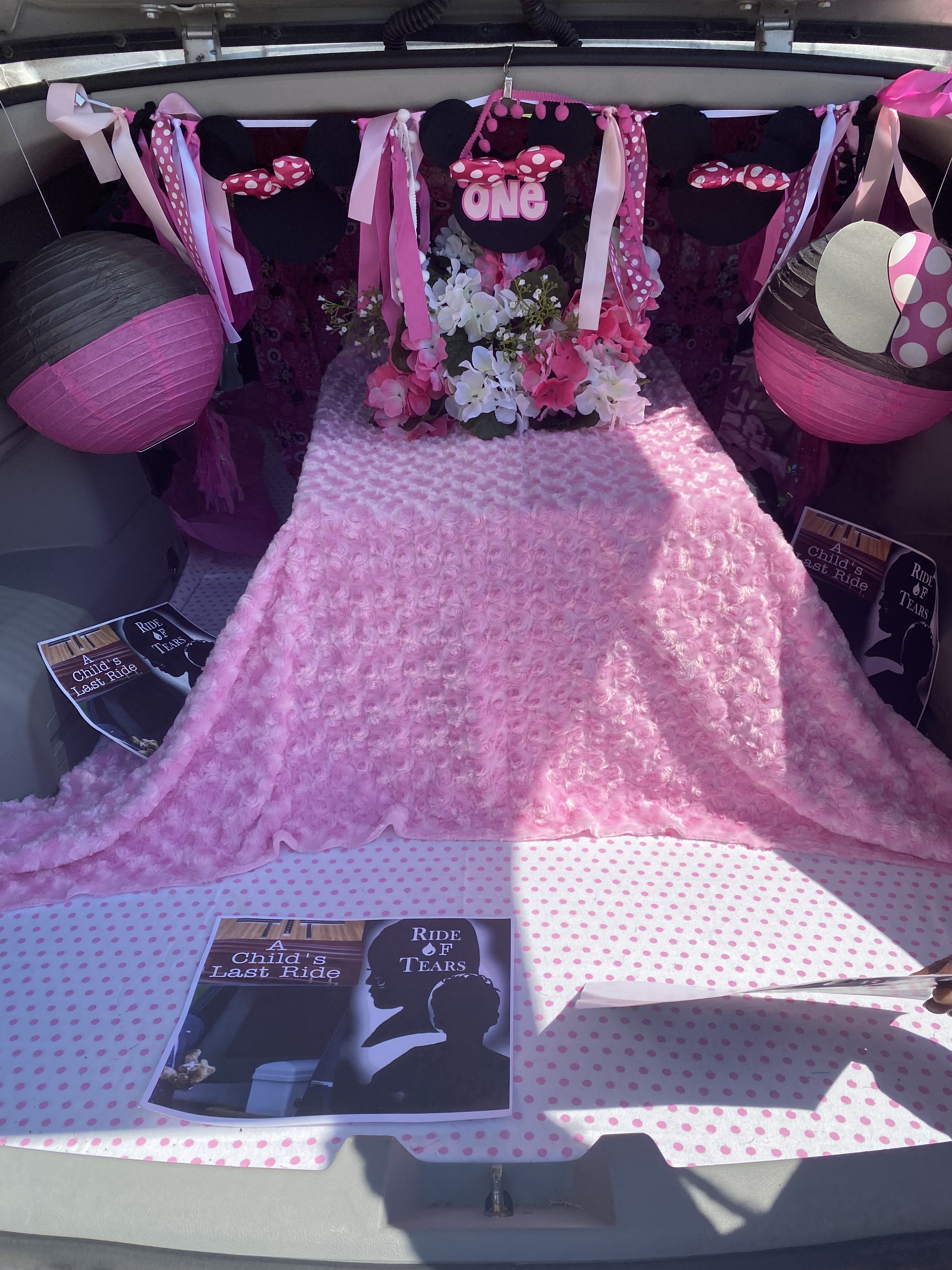 An empty child-sized casket sits in the back of a hearse that Mary Trice drives around Memphis, Tenn., to call attention to children killed by guns. (Courtesy Mary Trice)