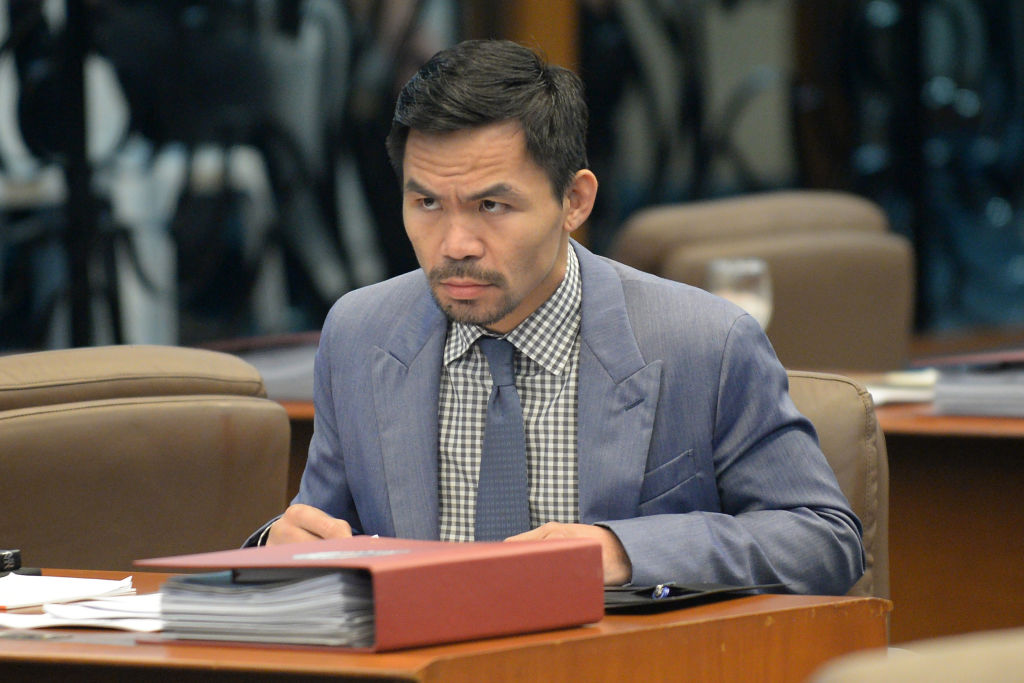 Philippine boxing icon and Senator Manny Pacquiao attends a senate session in Manila on February 13, 2017. (Ted Aljibe—AFP/ Getty Images)