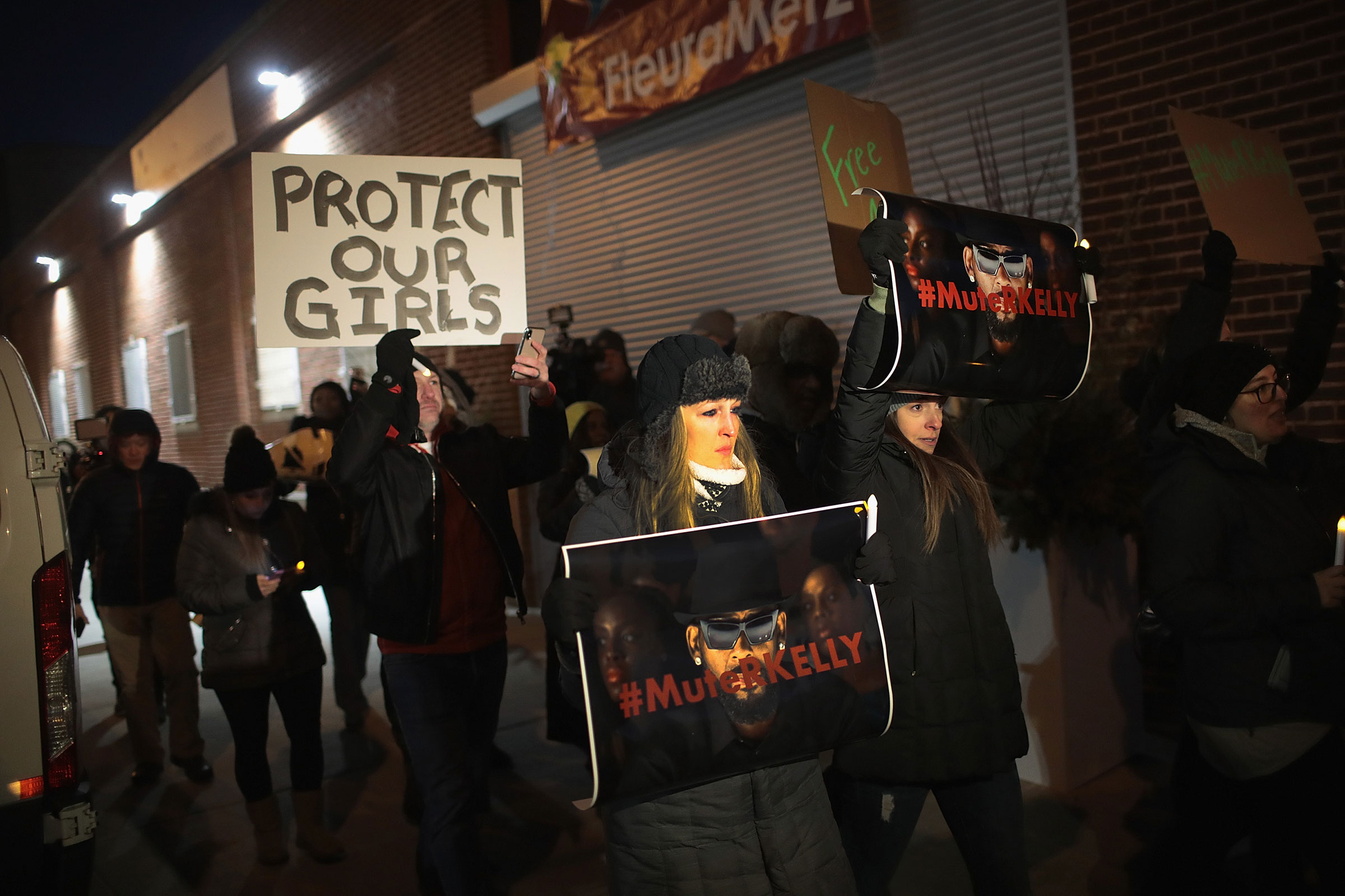 Demonstrators gather near the studio of singer R. Kelly to call for a boycott of his music after allegations of sexual abuse against young girls in Chicago, on Jan. 09, 2019. (Scott Olson—Getty Images)