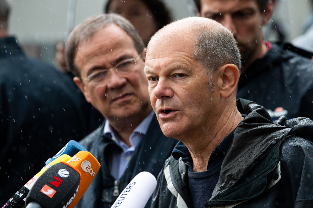 Olaf Scholz, federal finance minister and chancellor candidate of the German Social Democrats (SPD), talks to media affected by flash floods on Aug. 3, 2021 in Stolberg, Germany. (Lukas Schulze—Getty Images)