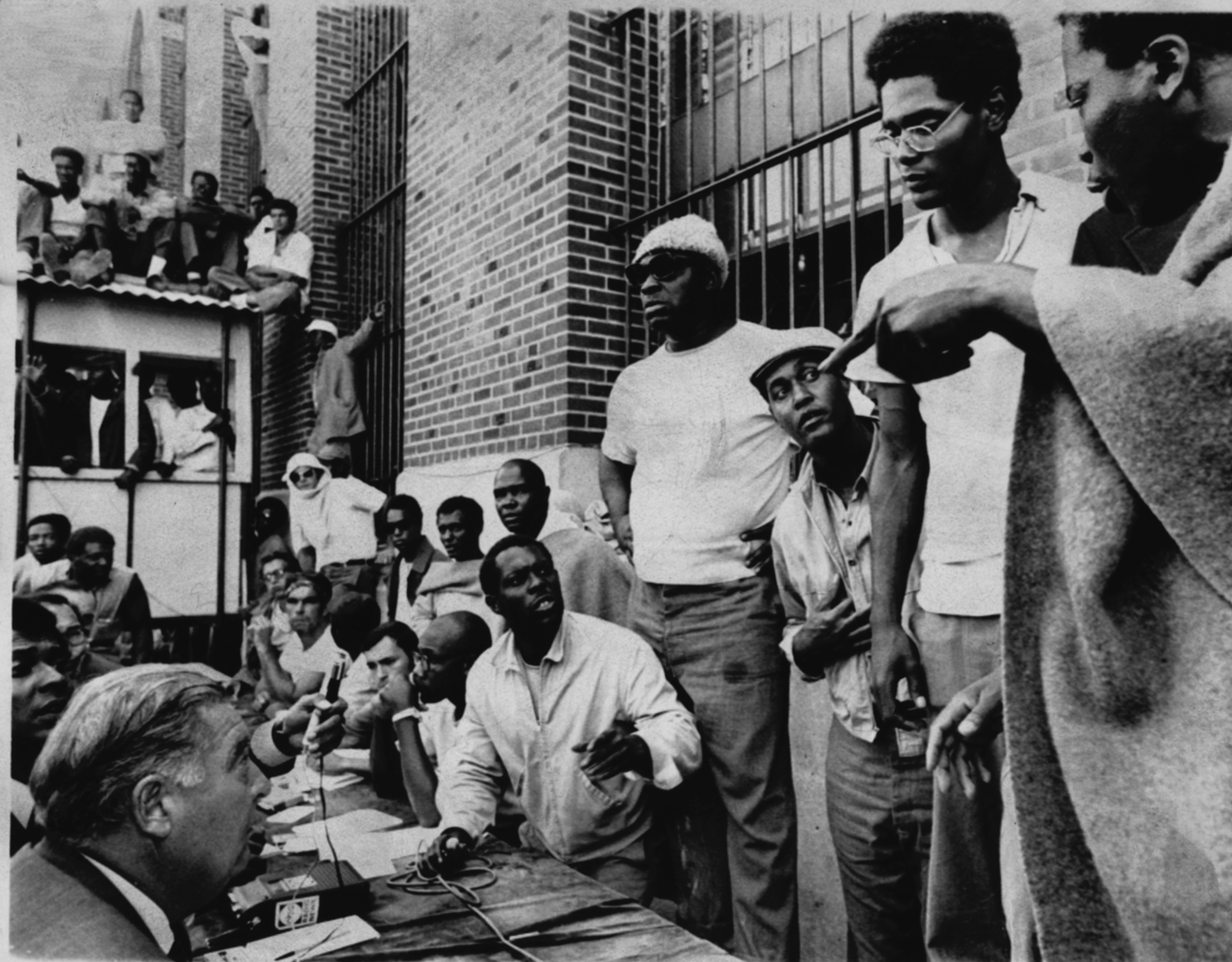 Attica prisoners, right, negotiate with State Commissioner of Corrections Russell Oswald, Sept. 10, 1971.