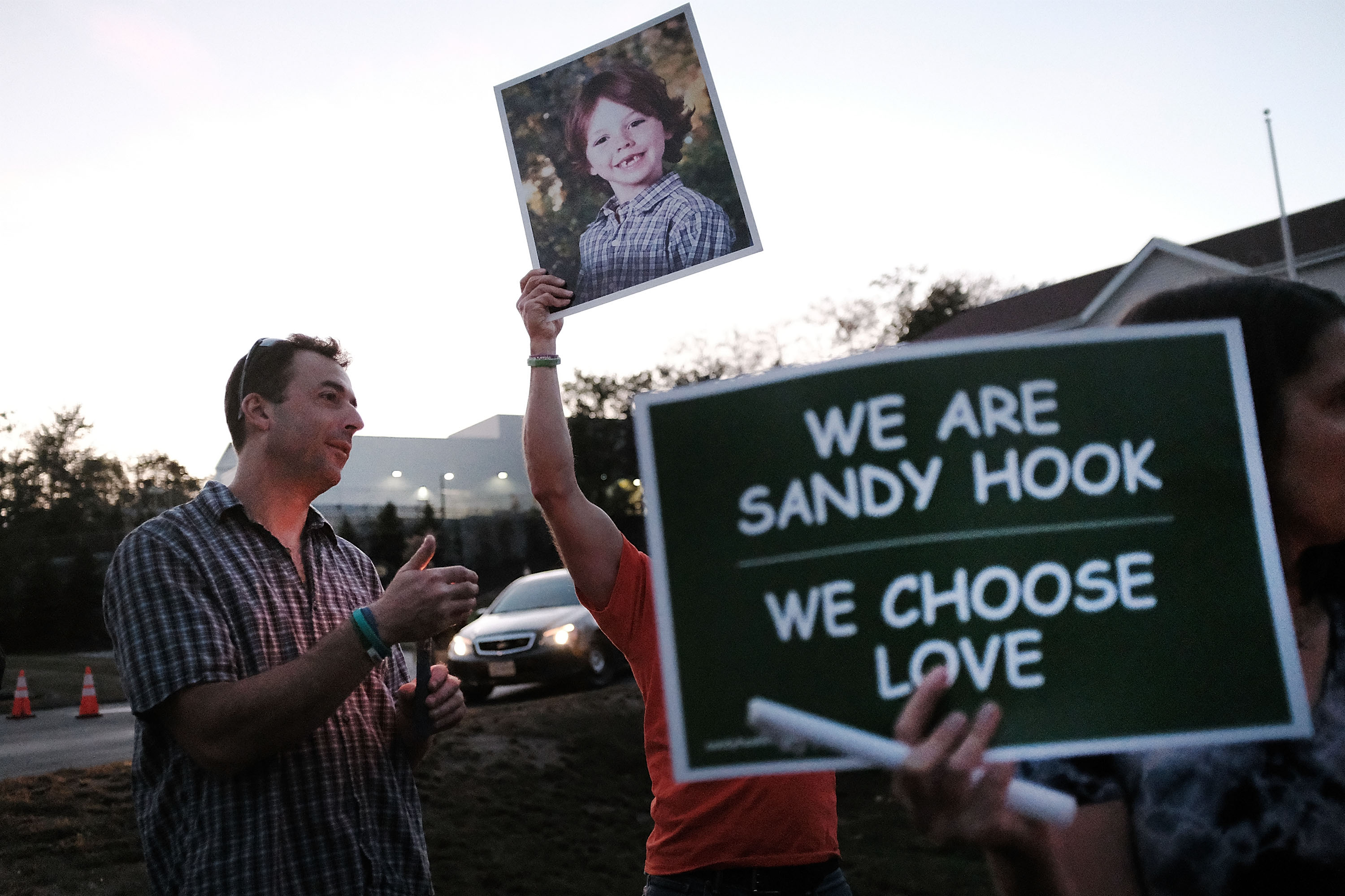 Mark Barden holds up a picture of his son, Daniel, on Oct 4, 2017, in Newtown, Conn. Daniel was one of 20 children killed in the Sandy Hook Elementary School massacre in December 2012. (Spencer Platt—Getty Images)