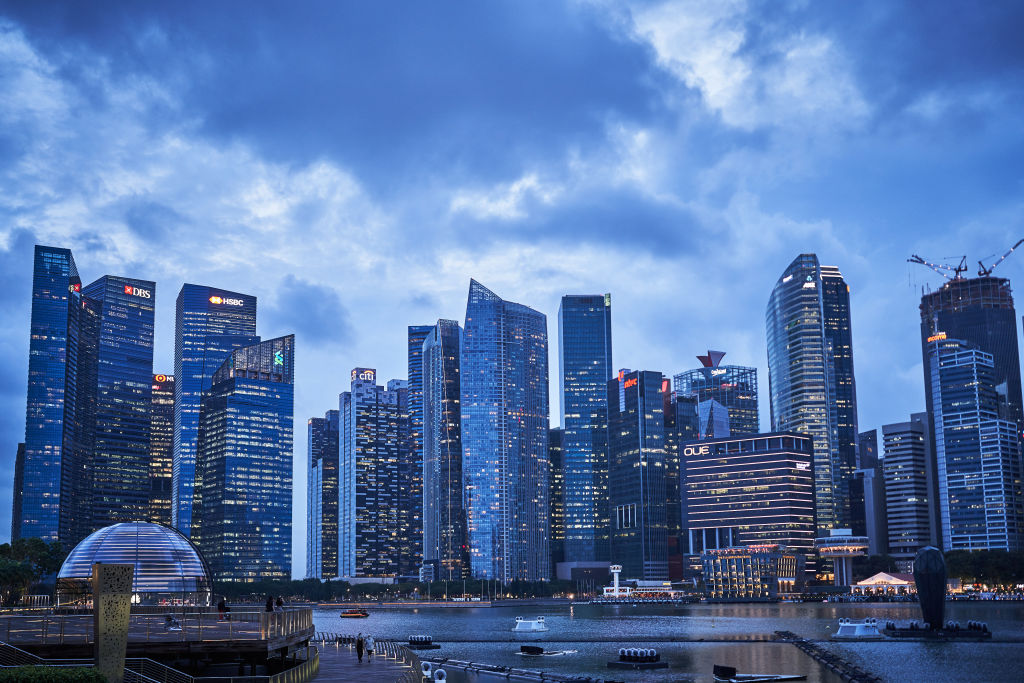 Buildings are illuminated at dusk in the central business district (CBD) of Singapore, on Jan. 28 2021. (Lauryn Ishak—Bloomberg/Getty Images)