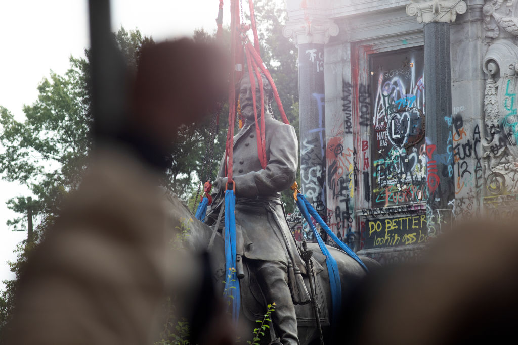 The statue of Confederate General Robert Lee is removed at Monument Avenue on Sept. 8, 2021 in Richmond, Va. (Andrew Lichtenstein—Corbis via Getty Images)