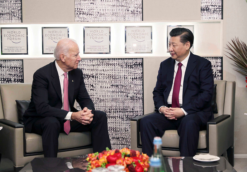 Chinese President Xi Jinping meets with then-Vice President Joe Biden in Davos, Switzerland, Jan. 17, 2017. (Lan Hongguang–Xinhua/Getty Images)