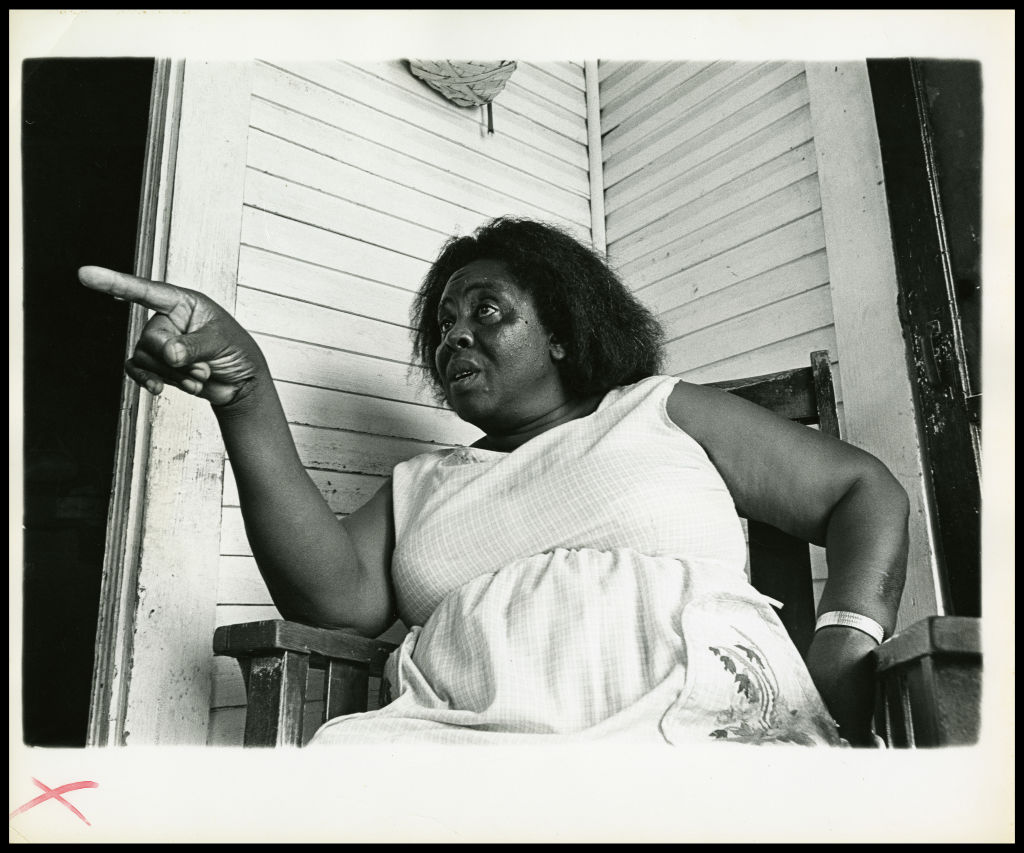Fannie Lou Hamer sits and points her finger in Ruleville, Mississippi, in 1969.