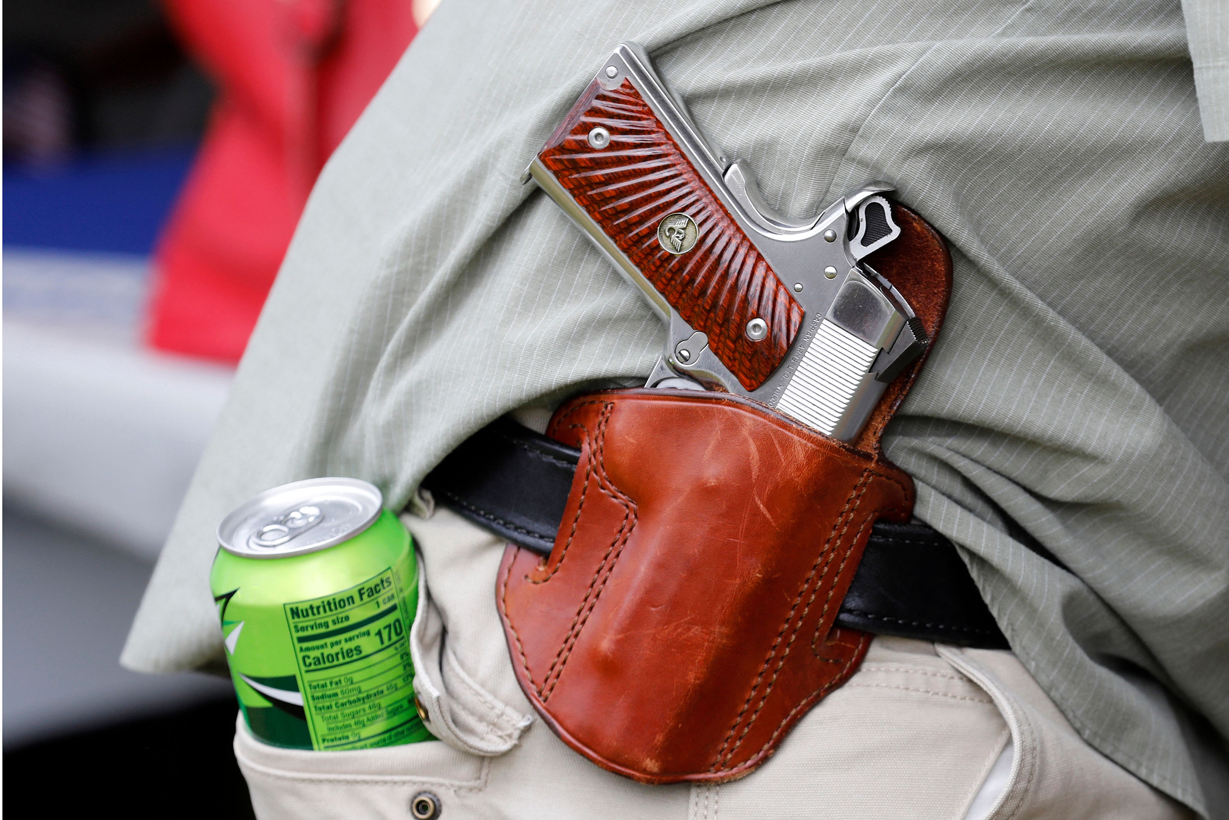 A demonstrator wears a gun on his belt during a rally supporting the 2nd Amendment in Fowlerville, Michigan on May 15, 2021. (Jeff Kowalsky—AFP/ Getty Images)