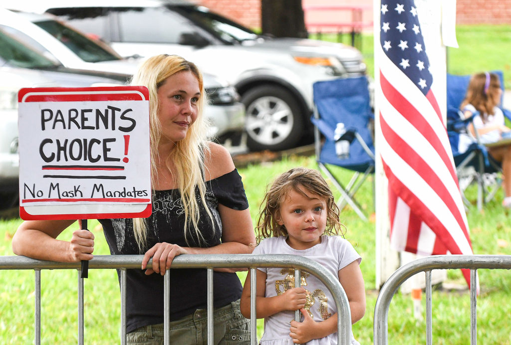 A protester outside the Volusia County School Board in Deland, Fla., on Sept. 14, 2021. The school board voted 3-2 to modify its mask mandate to allow parents to opt out of the requirement for their children. (Paul Hennessy—SOPA Images/LightRocket/Getty Images)