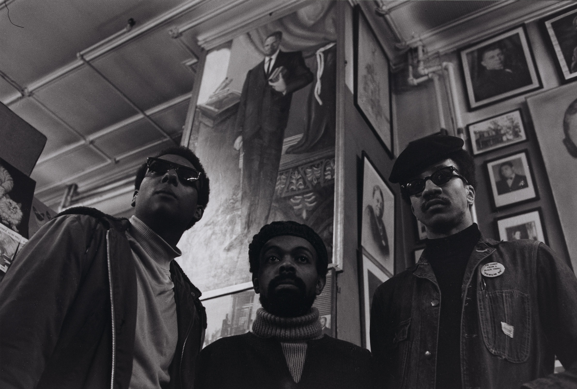 Stokely Carmichael, LeRoi Jones and Al-Amin, far right, at Michaux’s, a bookstore in Harlem, in 1976 (James E. Hinton—Library of Congress)