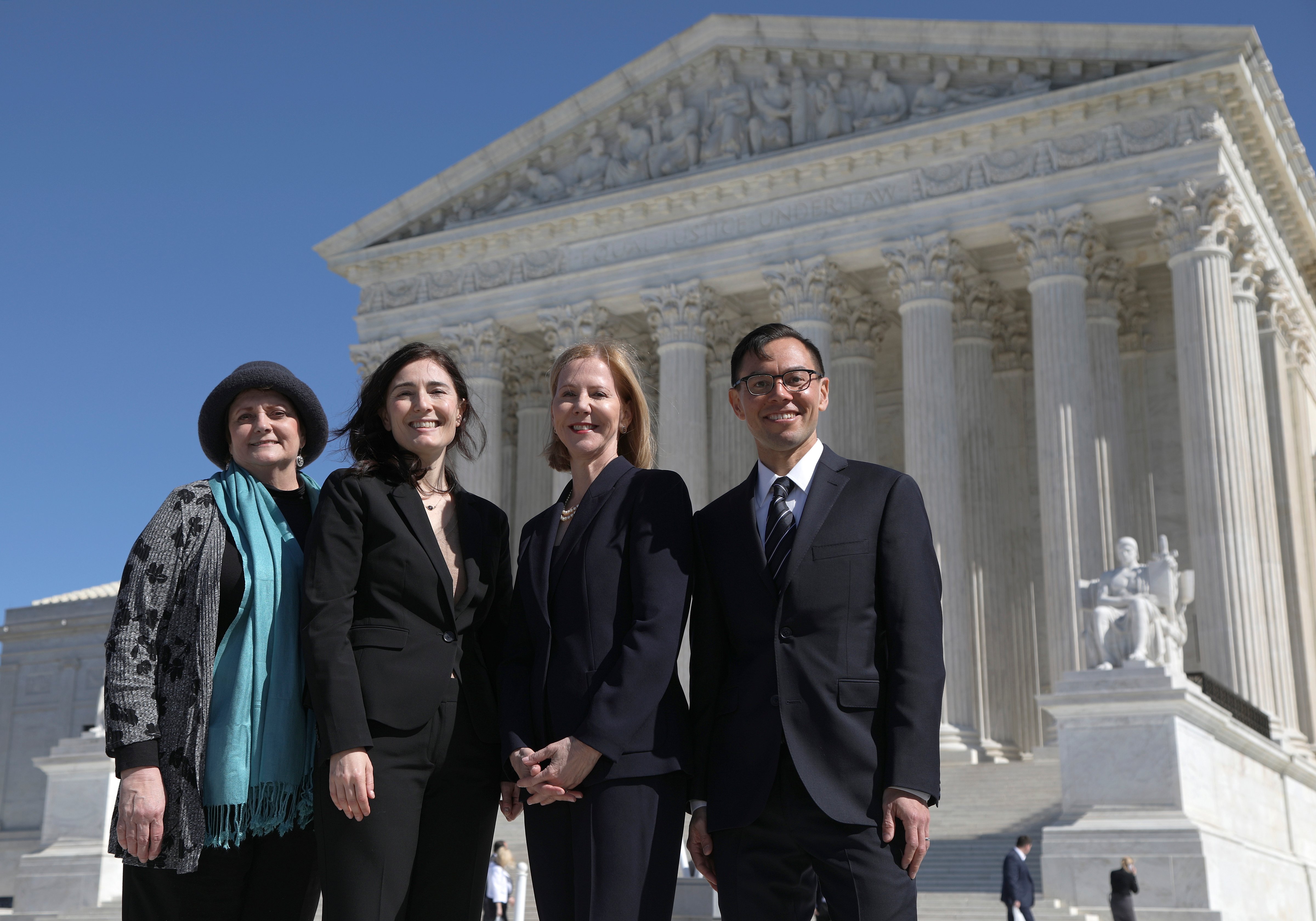 Kathaleen Pittman, of Hope Medical Group for Women, Rikelman, senior director of the Center for Reproductive Rights, Nancy Northup, center president, and T.J. Tu, the center's senior council for U.S. litigation, stand outside the U.S. Supreme Court after oral arguments in June Medical Services v. Russo on March 4. (Alyssa Schukar—Center for Reproductive Rights/AP)