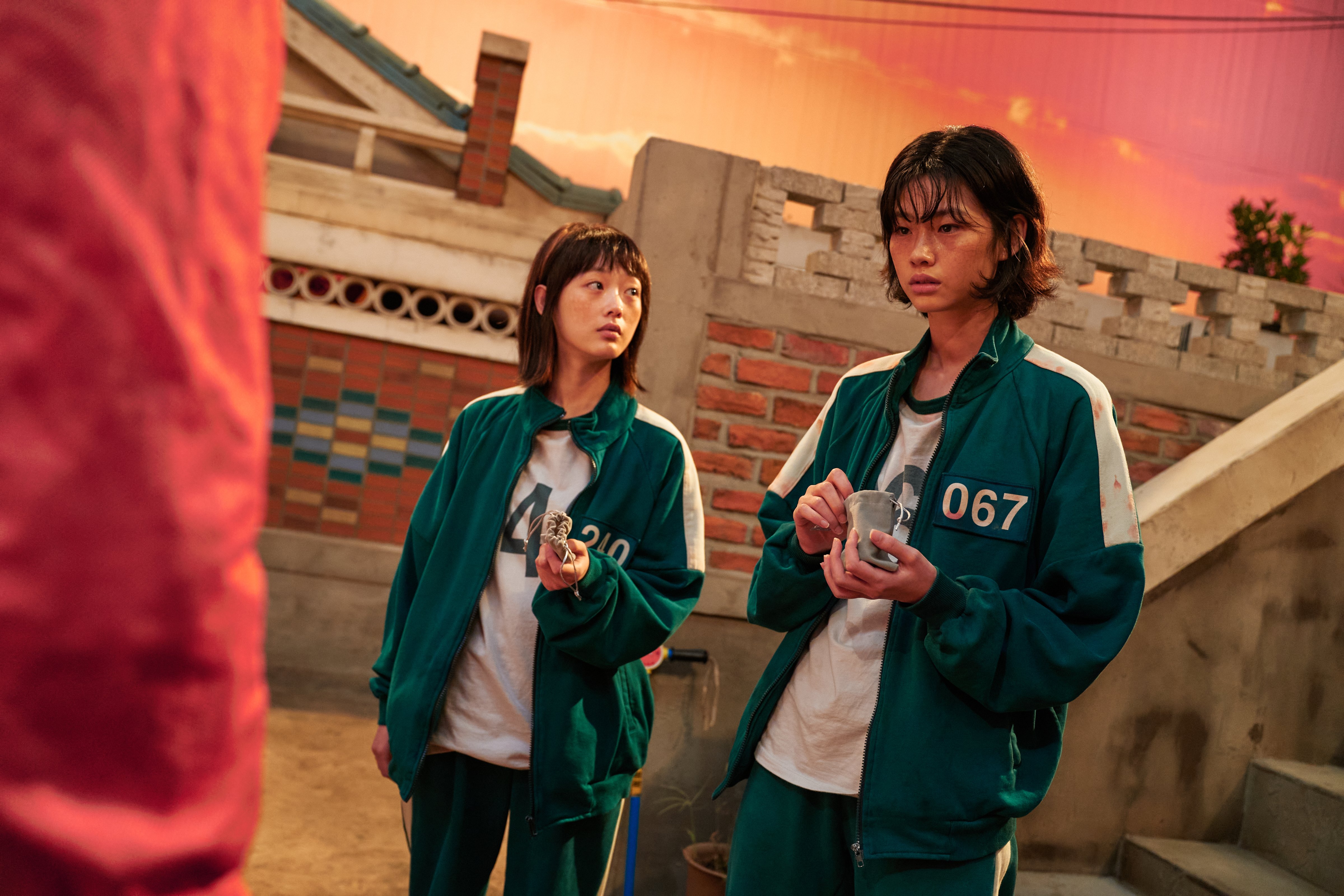 Lee Yoo-mi, left, as Ji-yeong and Jung Ho-yeon, right, as Kang Sae-byeok in Squid Game (Courtesy Netflix)