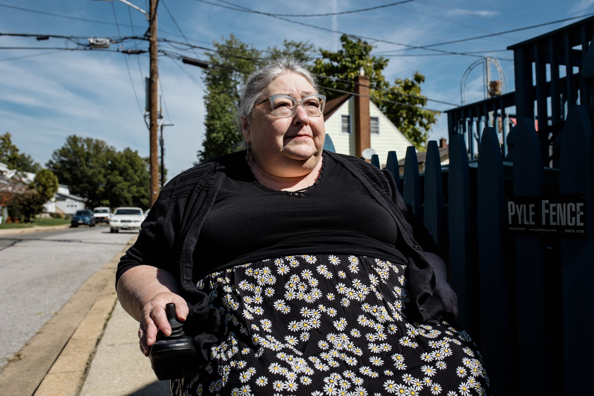 Susan Goodlaxson began using a wheelchair five years ago, following surgery for a brain tumor. On the block where she lives in Baltimore, there isn’t a single curb ramp ― despite requirements for such accessibility under the Americans With Disabilities Act. (Rosem Morton for KHN)