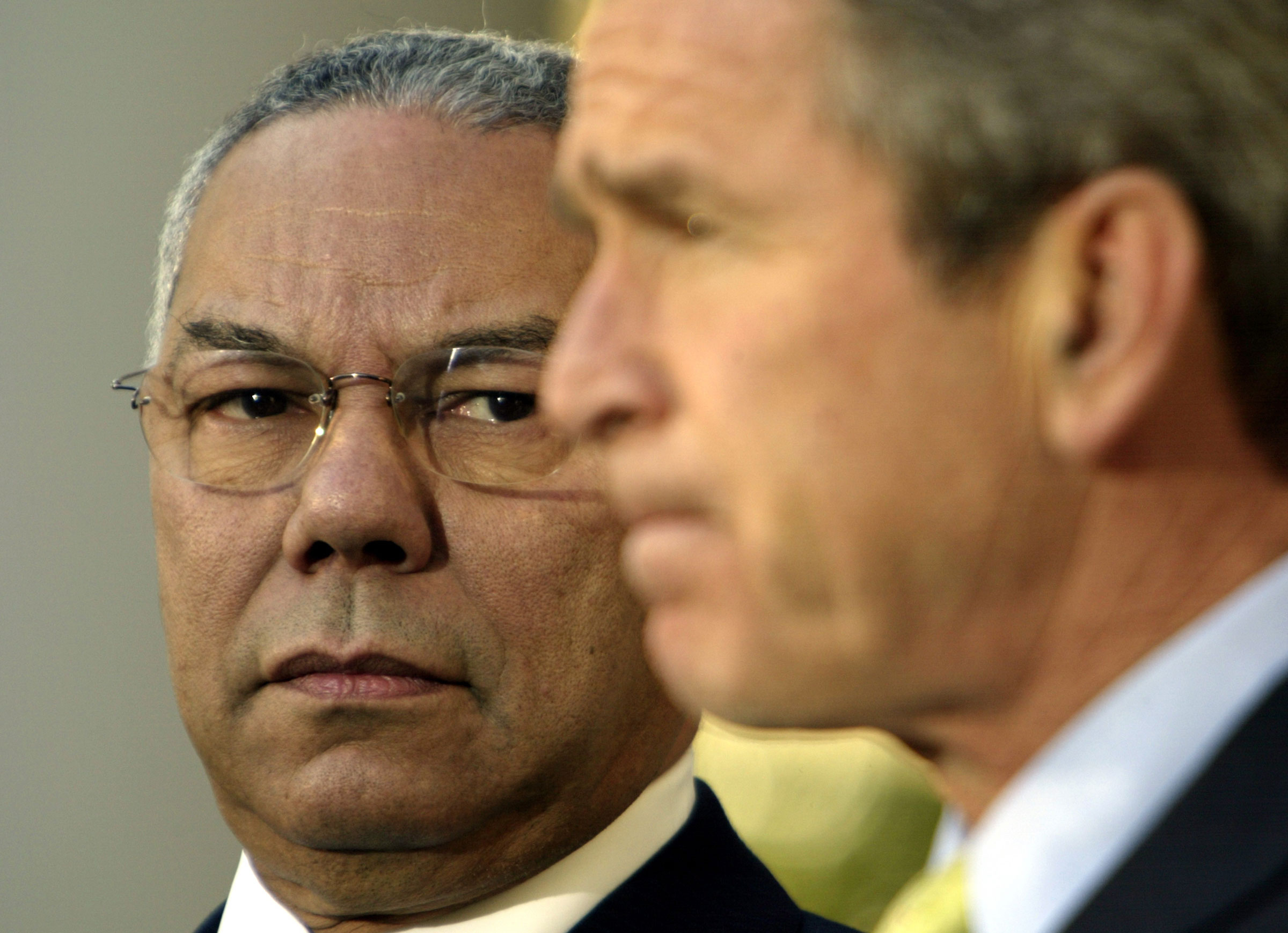 Secretary of State Colin Powell stands with President George W. Bush in 1990. (Brooks Kraft—Corbis/Getty Images)