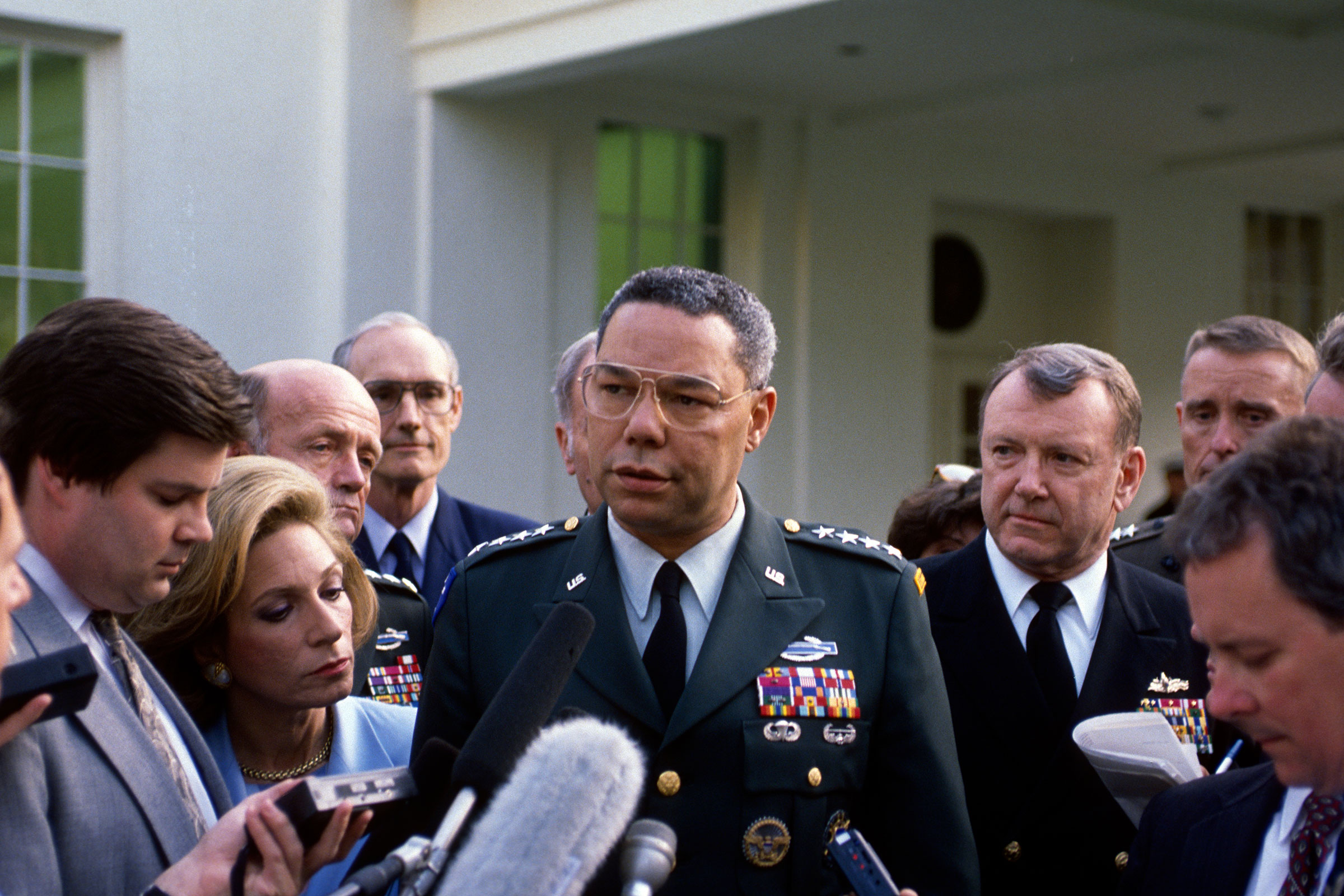 Chairman of the Joint Chiefs of Staff American General Colin Powell talks with reporters in the West Wing driveway, in 1993.