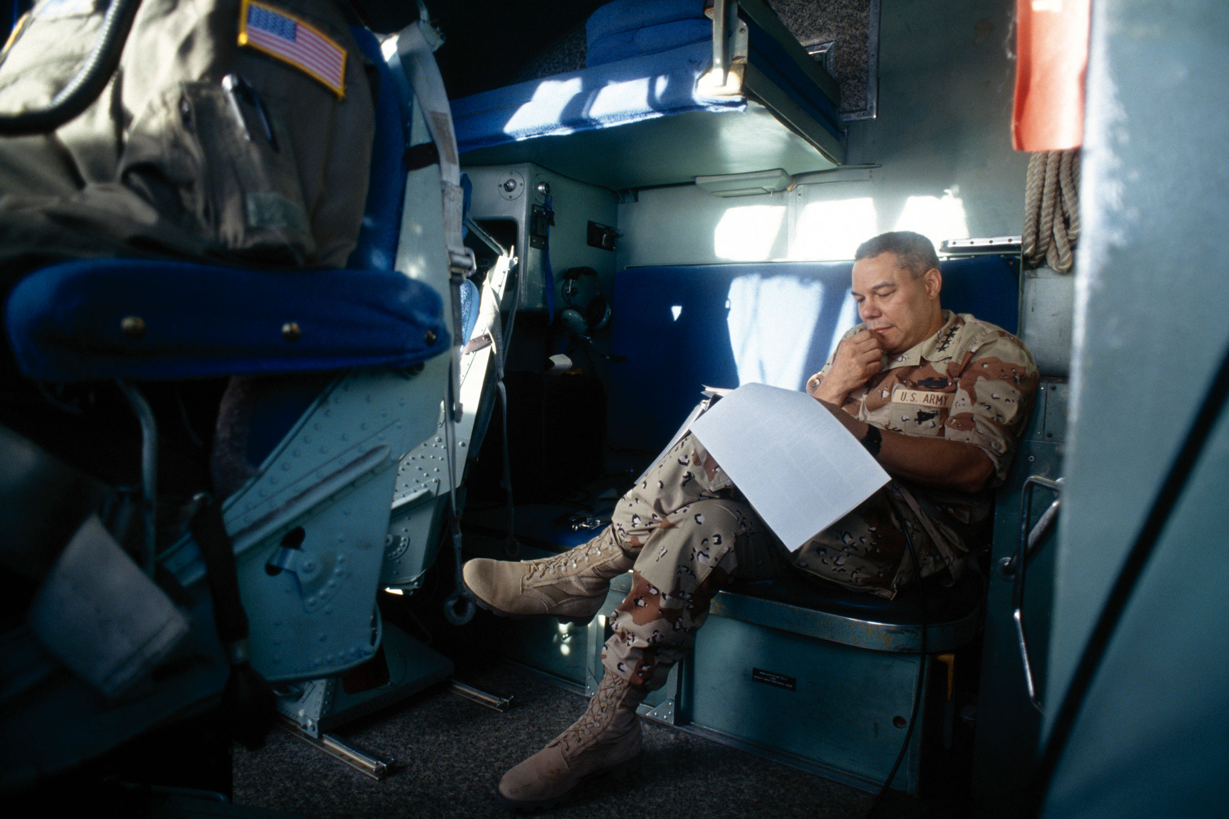 General Colin Powell, Chairman of the Joint Chiefs of Staff, reads during a trip to the USS Wasp, off the coast of Somalia, April 1993. (David Hume Kennerly—Getty Images)
