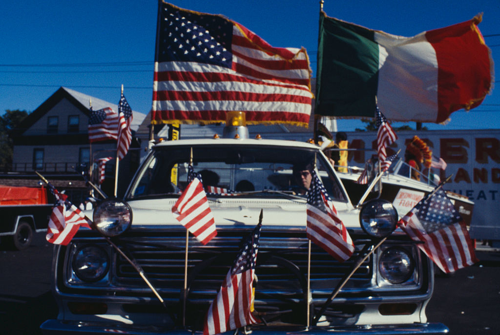 A car adorned with American and Italian flags at a Columbus Day Parade in Medford, Mass., in 1978. (Barbara Alper—Getty Images)