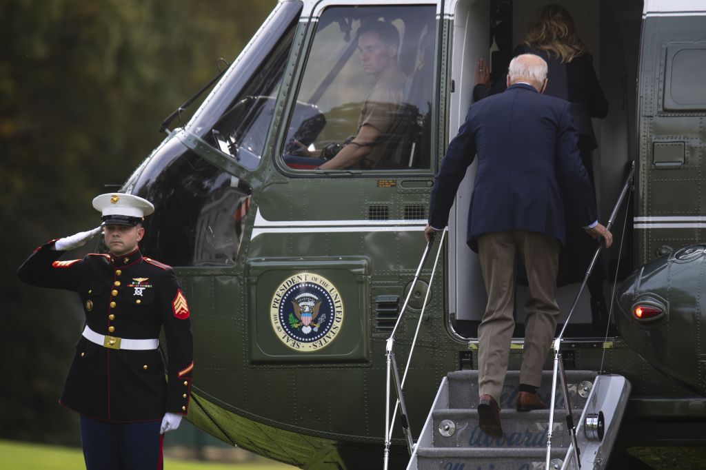 U.S. President Joe Biden and First Lady Jill Biden board Marine One on the South Lawn of the White House in Washington, D.C., U.S., on Thursday, Oct. 28, 2021. Biden unveiled a framework for a $1.75 trillion tax and spending package his Administration believes can pass Congress and urged House Democrats to quickly clear a separate public works bill for his signature, despite misgivings by progressives. (Tom Brenner/Bloomberg via Getty Images)
