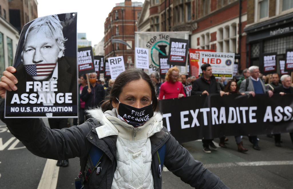 Protesters holding placards demanding Julian Assange is freed march, during a protest ahead of Julian Assange's extradition appeal on Oct. 23, 2021 in London, England. (Martin Pope—Getty Images)